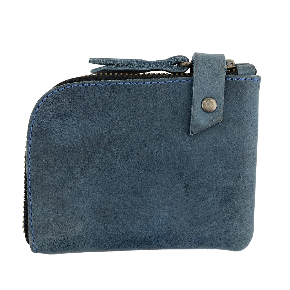 Side view of the blue Lion's Mane Zippered Wallet by Hide & Drink, showcasing its sleek design. Ideal for those looking for a stylish and durable means of organizing their essentials.