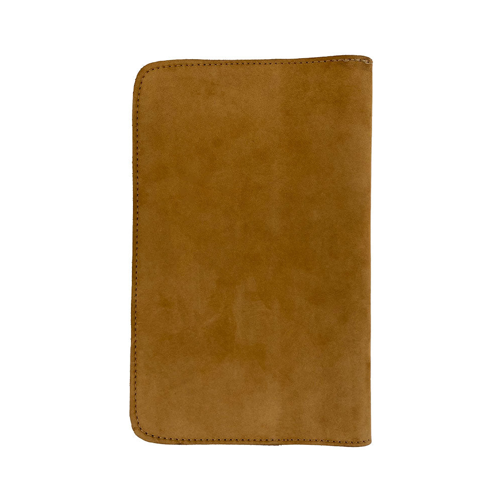 Open interior of a tan Journal Cover for Moleskine Cahier L (5 x 8.25 in.) by Hide & Drink, with a stylish bookmark. This refillable journal cover is perfect for large size (5 x 8.25 in.) notebooks, highlighting its rustic full grain leather.