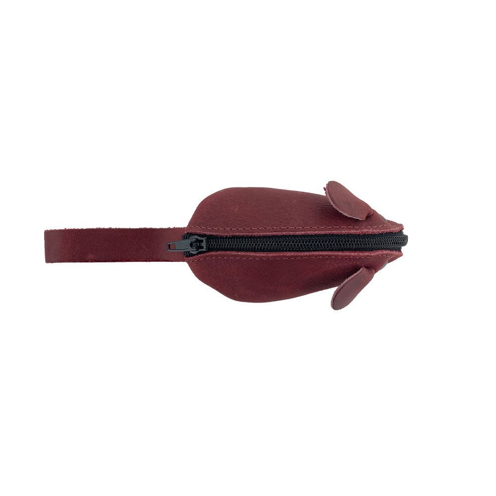 Top view of a burgundy Hide & Drink's Mouse Coin Pouch featuring its zipper closure. This Mouse-Shaped Coin Pouch is an adorable travel accessory, combining functionality with the charm of handcrafted full grain leather.