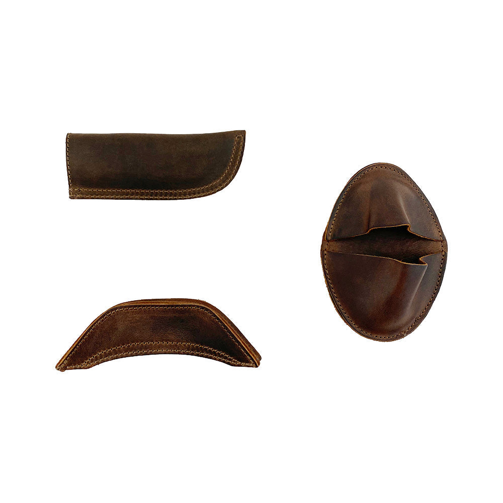 Another view of the Hide & Drink 3 Rustic Hot Handle Holders, including the Panhandle, Side Kick, and Grip Mitt crafted from Full Grain Leather. Ideal for cast iron cookware, this set is part of Small Batch Production, with each item Hand Cut and Hand Sewn by artisan makers in La Antigua Guatemala & Oaxaca Mexico.