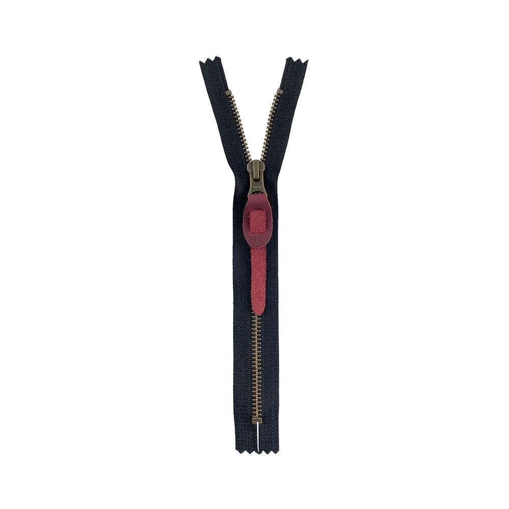 Versatile Rustic Zipper Pull Replacement from Hide & Drink, made of fine full grain leather. This zipper pull is part of a collection of 6, ideal for personalizing backpacks, jackets, wallets, luggage, and bags. Each piece is hand crafted and fire branded in La Antigua Guatemala & Oaxaca Mexico.