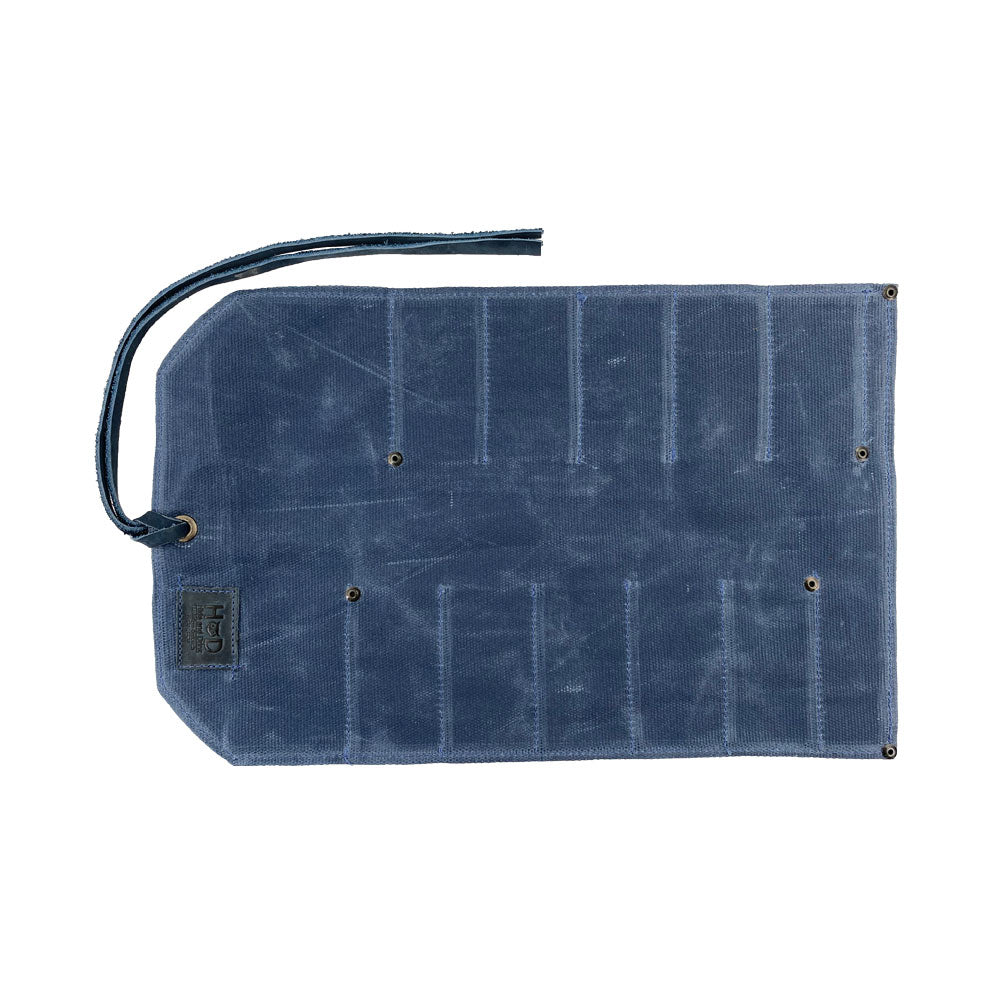 Hide & Drink Tool Roll features a refined small tool roll-up bag with 10 slots, crafted from fine full grain leather. Perfect as a portable carry-on pouch for woodworking tools, it elevates your workshop storage options. Each handmade item is produced in La Antigua Guatemala & Oaxaca Mexico, highlighting artisan craftsmanship.