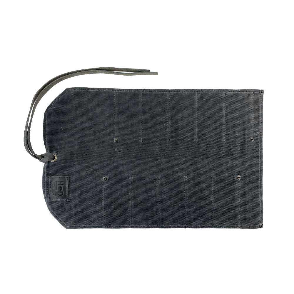 Hide & Drink Tool Roll presents a compact small tool roll-up bag with 10 slots, made from fine full grain leather. Perfect as a portable carry-on pouch for woodworking tools organization, it enhances any workshop storage setup. Handmade in La Antigua Guatemala & Oaxaca Mexico, highlighting artisan craftsmanship.