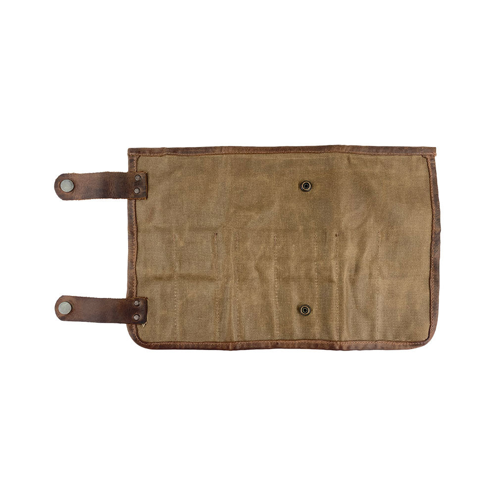 Close-up of Hide & Drink's Barber Tool Roll, this Snap Tool Roll Up Bag with 14 Slots is perfect for scissors & screwdrivers. Made from Full Grain Leather, this portable carry case embodies StockyardX's small batch production ethos, handcrafted, hand cut, hand sewn, and fire branded in La Antigua Guatemala & Oaxaca Mexico.