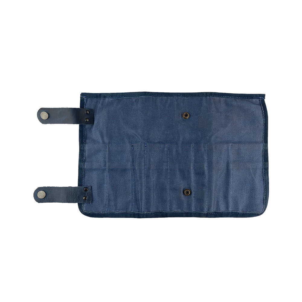 Hide & Drink presents its Barber Tool Roll, featuring a Snap Tool Roll Up Bag with 14 Slots, intended for storage of scissors & screwdrivers. Made from durable Full Grain Leather, this portable carry case aligns with StockyardX's small batch production approach, artisan crafted, hand cut, hand sewn, and fire branded in La Antigua Guatemala & Oaxaca Mexico.
