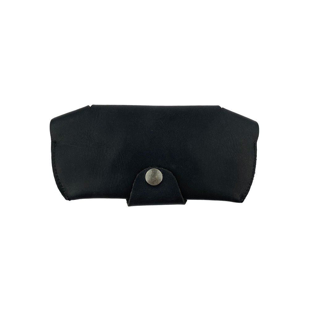 Back view of the black Foldable Sunglass Case by Hide & Drink with a secure closure. Famed for its artisan craftsmanship, this Full Grain Leather case highlights small batch production and fire branding for authenticity.