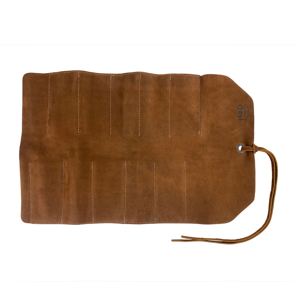 Hide & Drink Tool Roll features an expertly designed small tool roll-up bag with 10 slots, made from premium full grain leather. This portable carry-on pouch is perfect for organizing woodworking tools at your workshop. Handmade with precision, it is produced in La Antigua Guatemala & Oaxaca Mexico, highlighting artisan dedication.