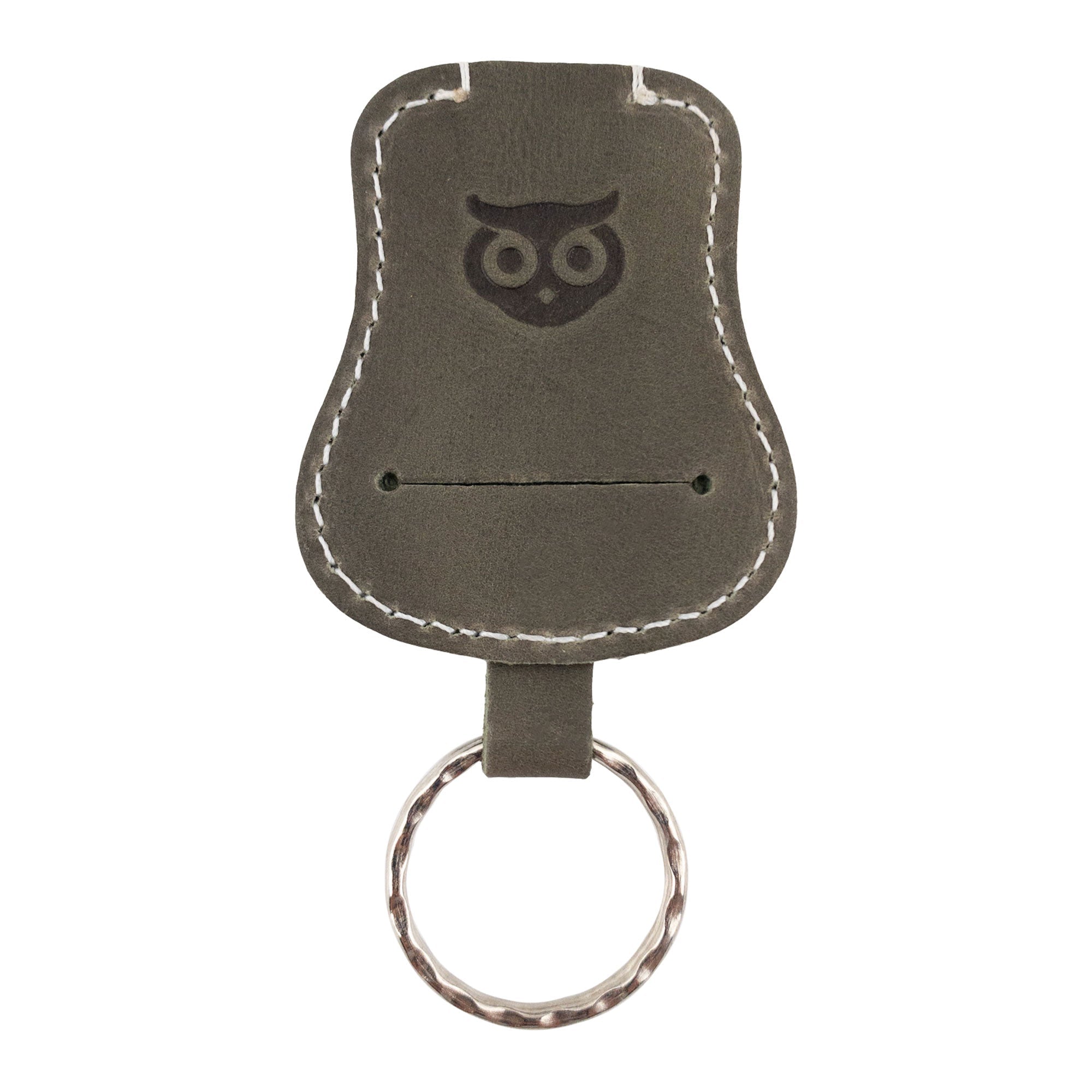 Another angle of the gray Guitar Keychain by Hide & Drink, ideal for convenient key storage. This handmade key holder is crafted from Full Grain Leather, showcasing the quality artisan skills from La Antigua Guatemala & Oaxaca Mexico.