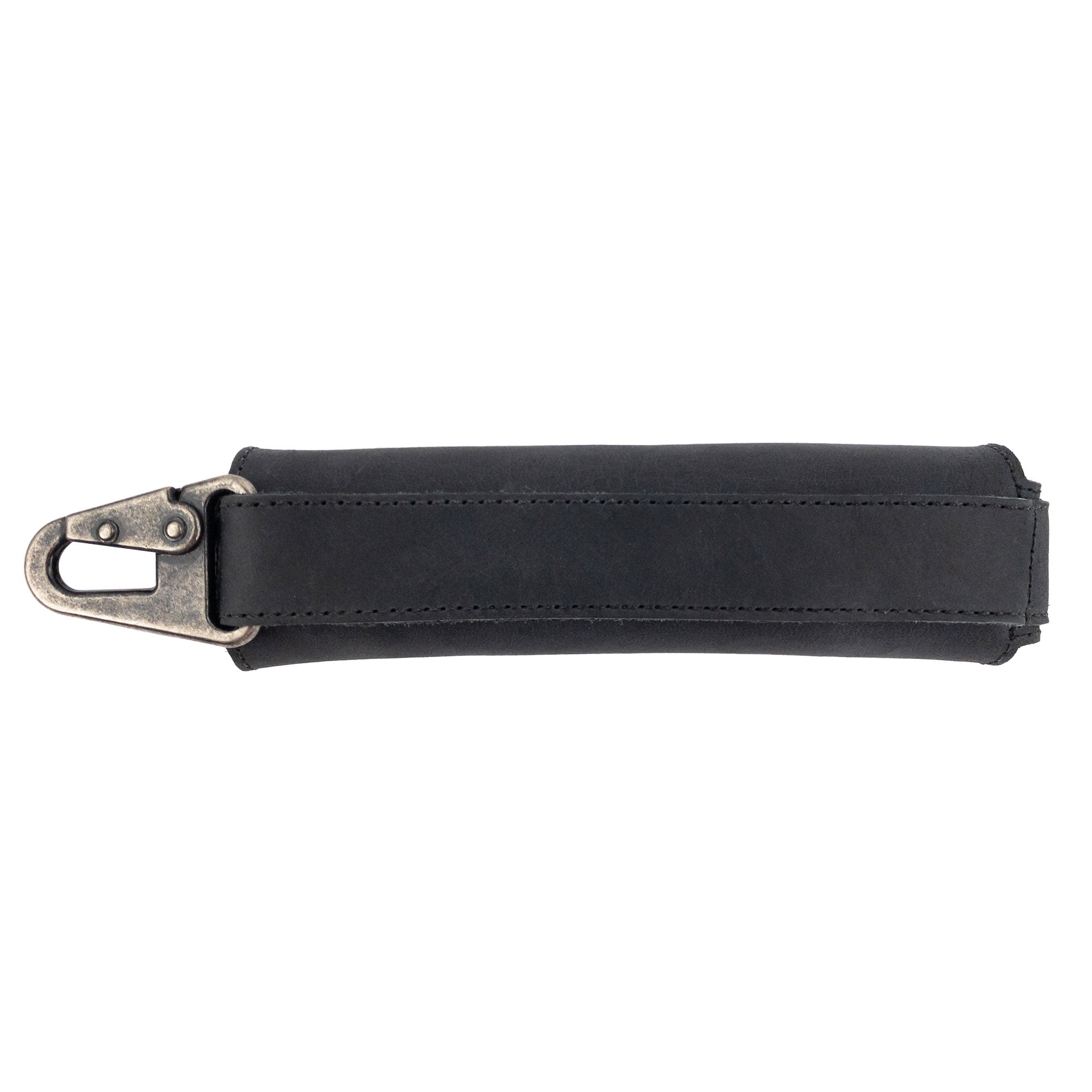 Side view of a black Harmonica Case by Hide & Drink, featuring a sturdy clasp for secure carrying. This full grain leather protector is an essential musician accessory, showcasing artisan quality and small batch production from La Antigua Guatemala.