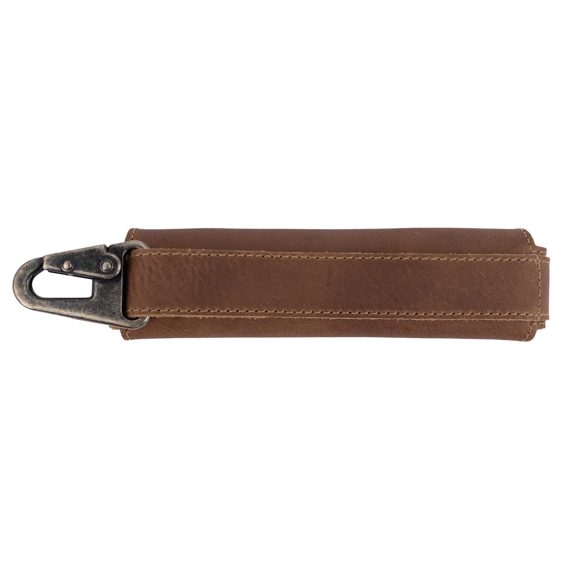 Side view of the brown Harmonica Case by Hide & Drink, showing its sturdy clasp. This full grain leather instrument cover is designed for musicians, reflecting quality craftsmanship and small batch production.