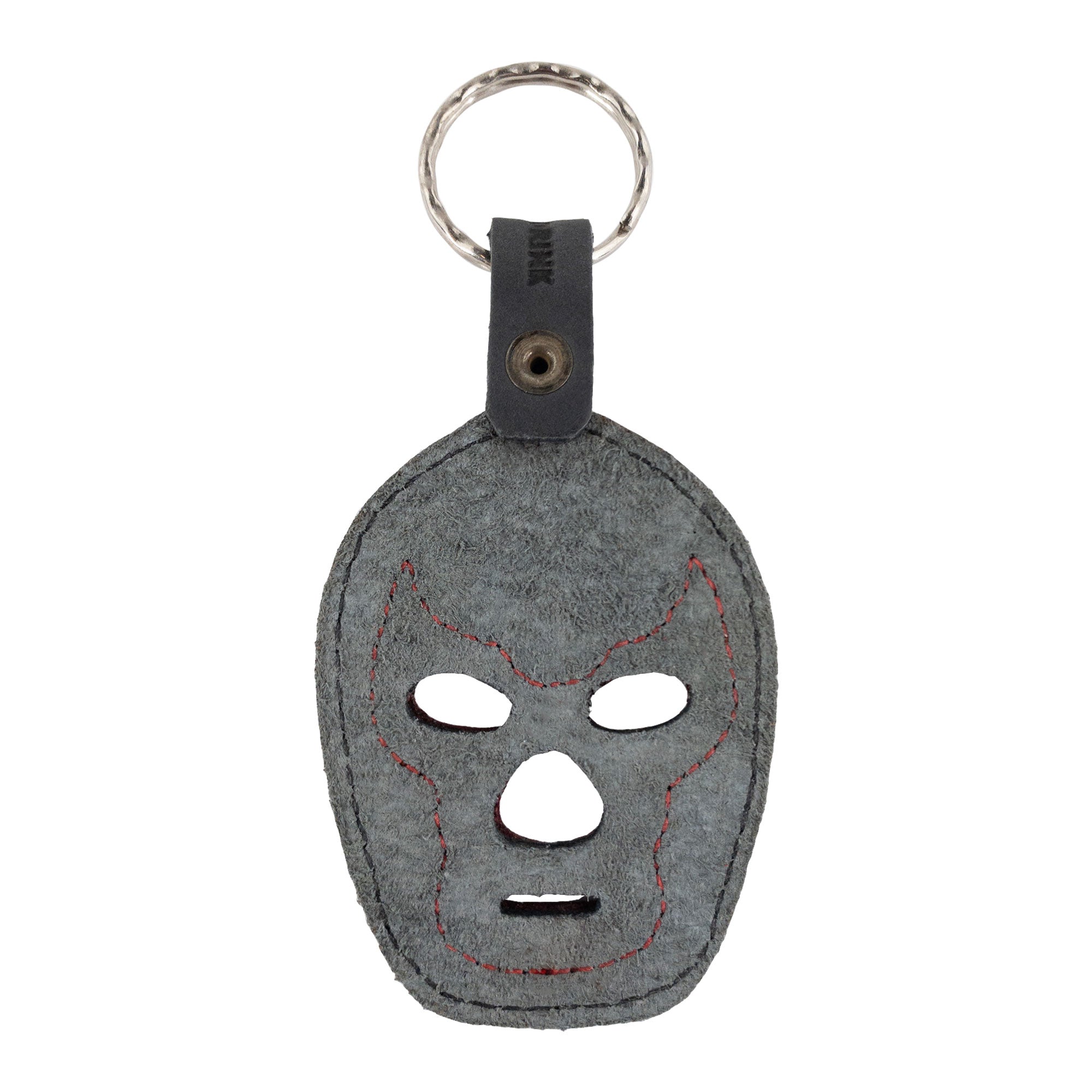 A dark Luchador Mask Leather Keychain featuring handcrafted details, serving as a stylish keyring. From Hide & Drink, this key organizer is crafted from premium full grain leather, embodying small batch production principles, hand cut, hand sewn, and fire branded by skilled artisans in La Antigua Guatemala and Oaxaca Mexico.