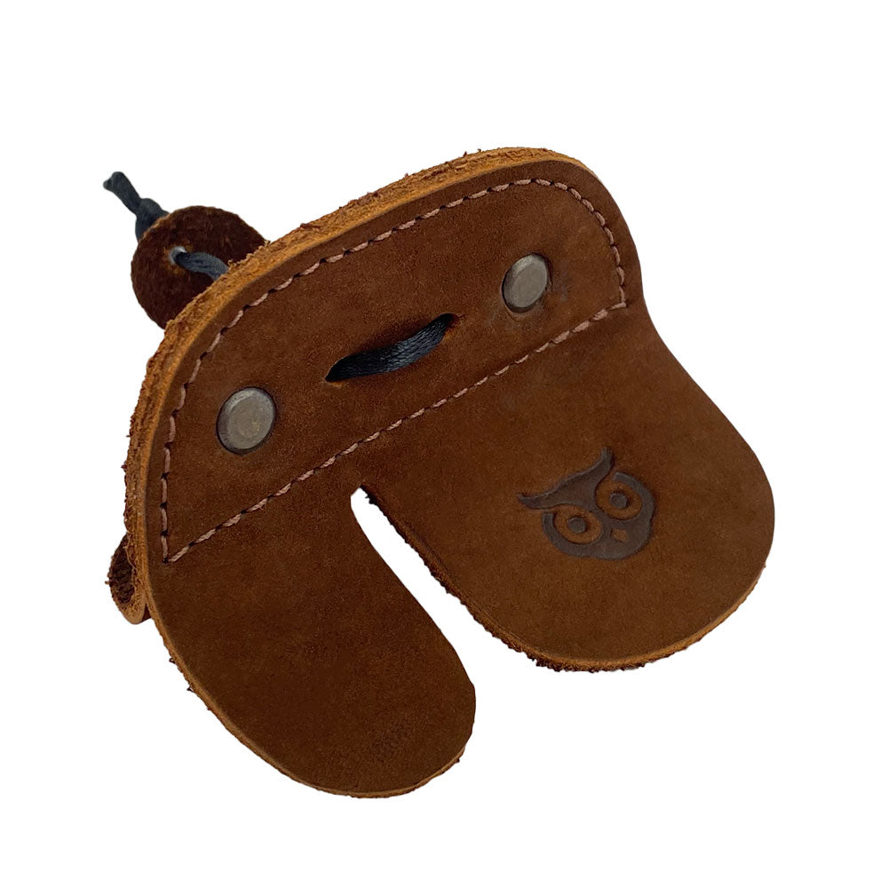 Right Handed Archery Finger Protector by Hide & Drink features a unique design made from high-quality full grain leather. An essential archery finger tab that acts as a protect guard for recurve bows, perfect for shooting practice gear sports & outdoors. This handmade item emphasizes artisan craftsmanship with small batch production, hand cut and hand sewn in La Antigua Guatemala.