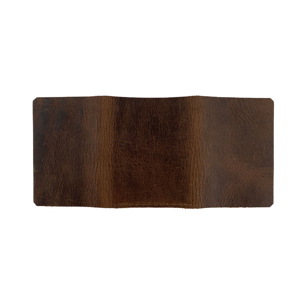 An elegant view of the Hide & Drink Minimalist Wallet Bills Only, made from high-quality Full Grain Leather. This Ultra Minimalist Wallet serves as a reliable cash organizer, reflecting the artisan craftsmanship from La Antigua Guatemala and Oaxaca Mexico, with details of hand cut construction.