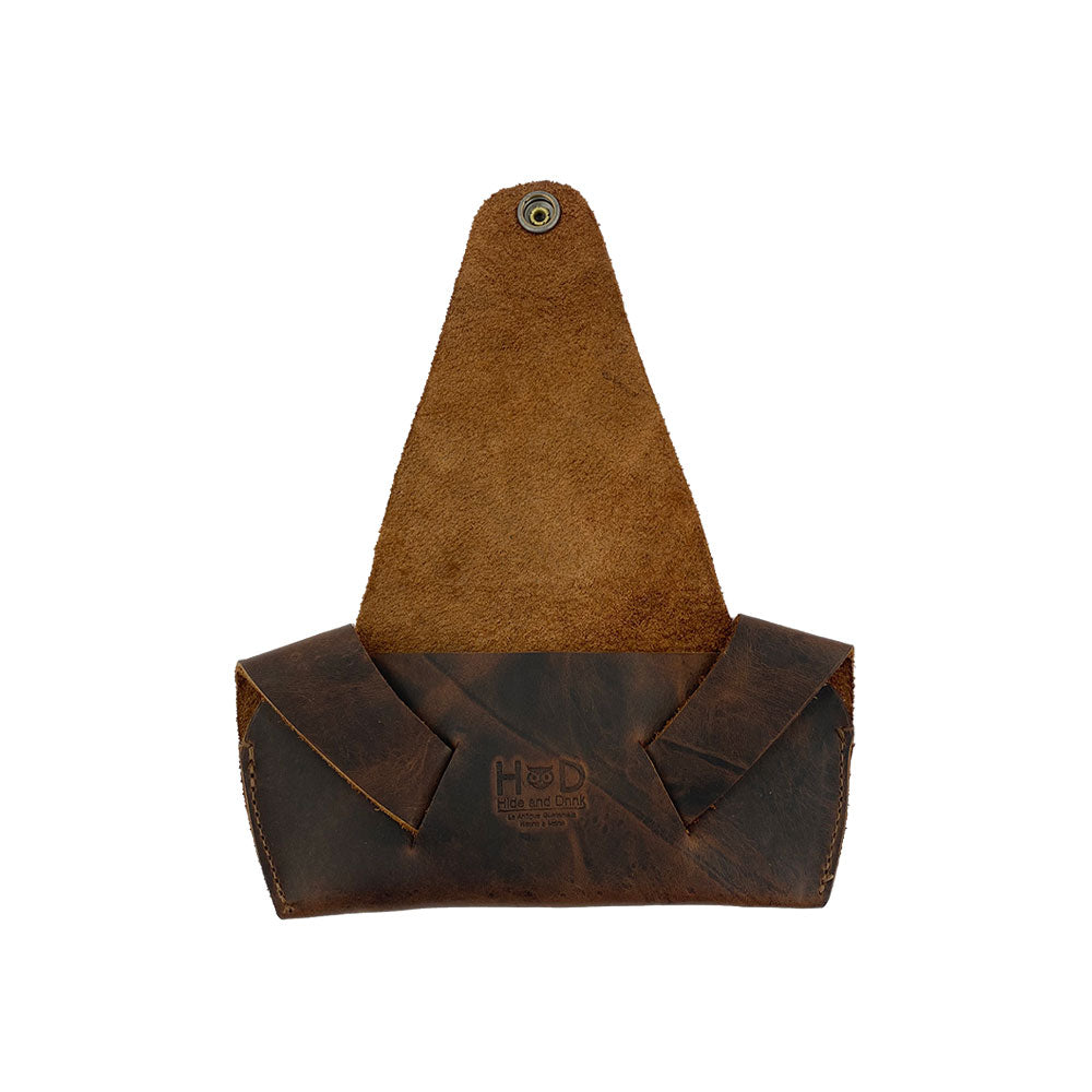 Inside view of the Foldable Sunglass Case by Hide & Drink, designed to fit sunglasses snugly. Made from Full Grain Leather, this artisan accessory is hand cut and fire branded, reflecting its handmade origins in La Antigua Guatemala and Oaxaca, Mexico.