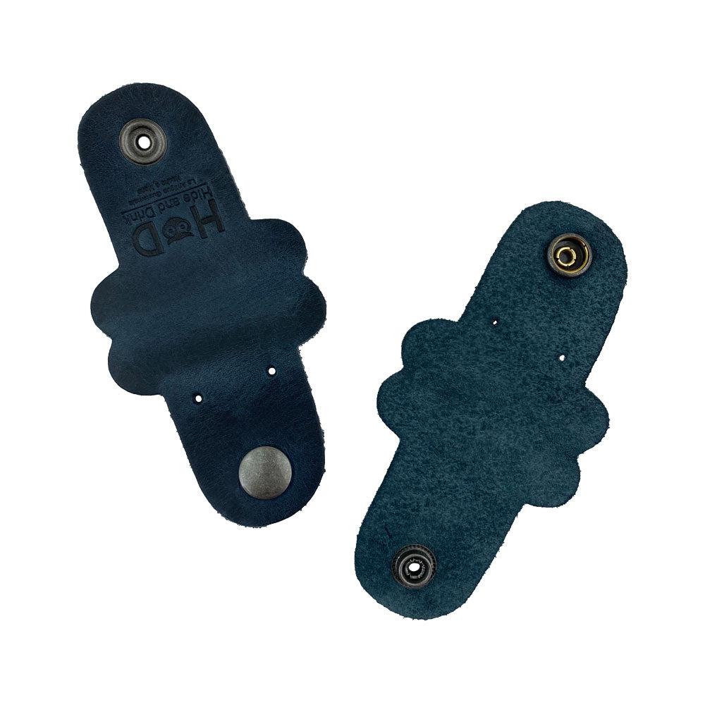 Back view of two navy blue Dog Shaped Cord Keepers with snaps, expertly designed by Hide & Drink from durable Full Grain Leather. Dog Shaped Cord Keeper (Cord Clam) 2-Pack, Full Grain Leather, StockyardX, Small Batch Production, Hand Cut, Hand Sewn, Fire Branded, Artisan, Handmade in La Antigua Guatemala & Oaxaca Mexico.