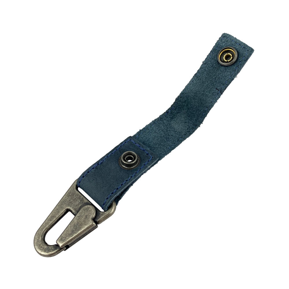 Side view of the blue Key Ring Holder by Hide & Drink featuring an easy clip attachment. Constructed from Full Grain Leather, it represents Small Batch Production and Hand Sewn craftsmanship. Handmade in La Antigua Guatemala & Oaxaca Mexico.