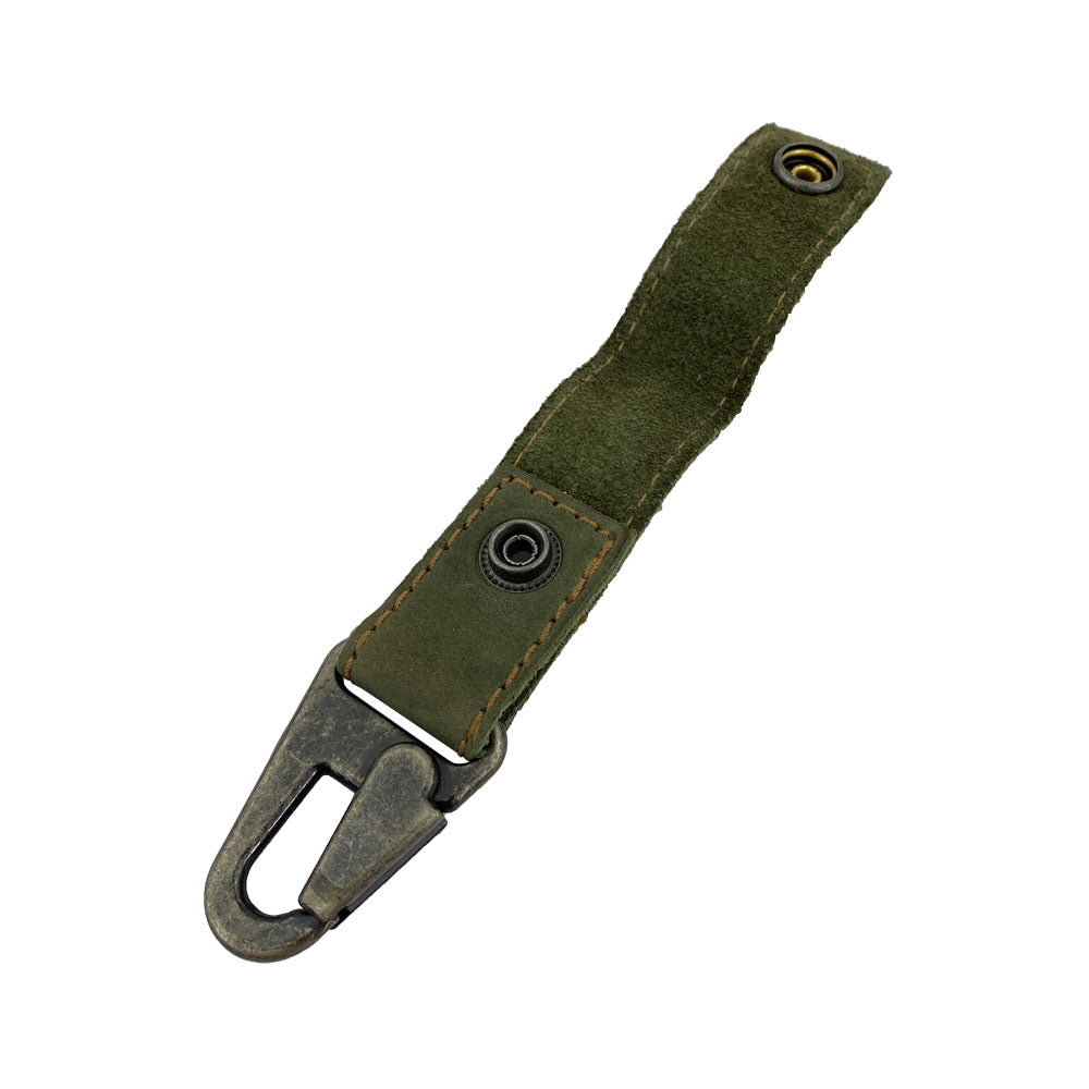 Hide & Drink Key Ring Holder elegantly styled with olive green leather, showing the durability and craftsmanship. This artisan piece, made from Full Grain Leather, highlights Small Batch Production through Hand Cut and Hand Sewn techniques.