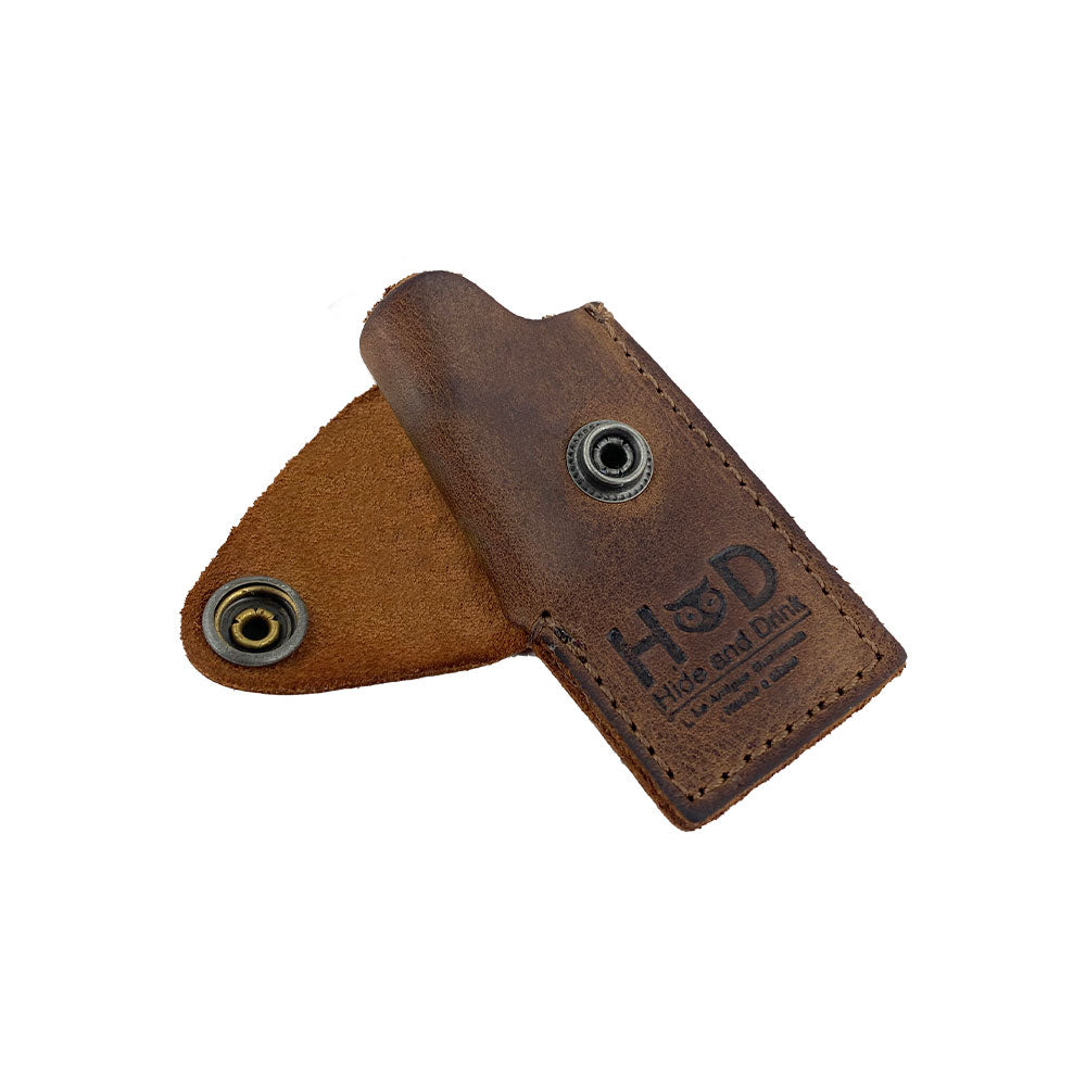 Open view of the Hide & Drink Lighter Protective Case, showcasing the artisanal full grain leather and brass snap closure. Perfectly designed for a snug fit, made in La Antigua Guatemala & Oaxaca Mexico. Relevant keywords: Lighter Protective Case, Full Grain Leather, StockyardX, Artisan, Handmade.