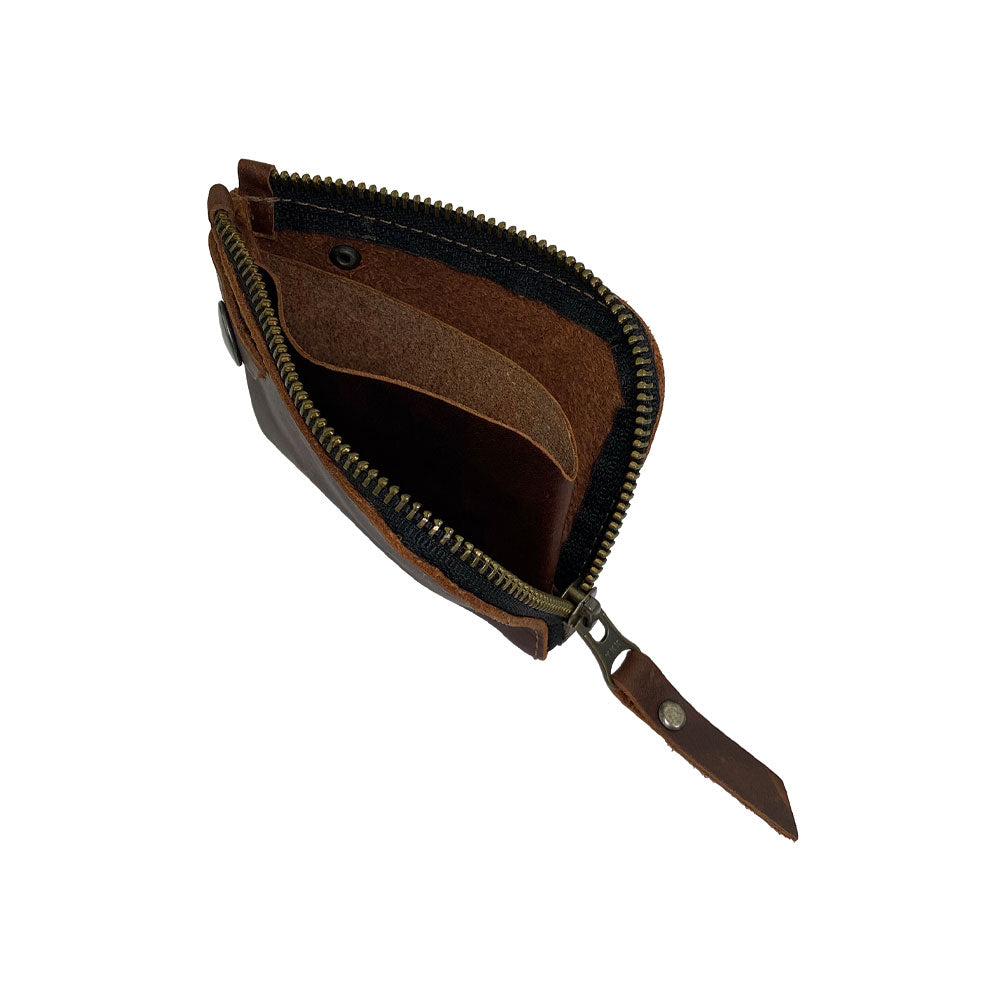 Interior view of the Lion's Mane Zippered Wallet by Hide & Drink, highlighting its capacity to hold cards and coins. With its artisan craftsmanship and handmade quality, it's a practical pouch organizer for those on the go.