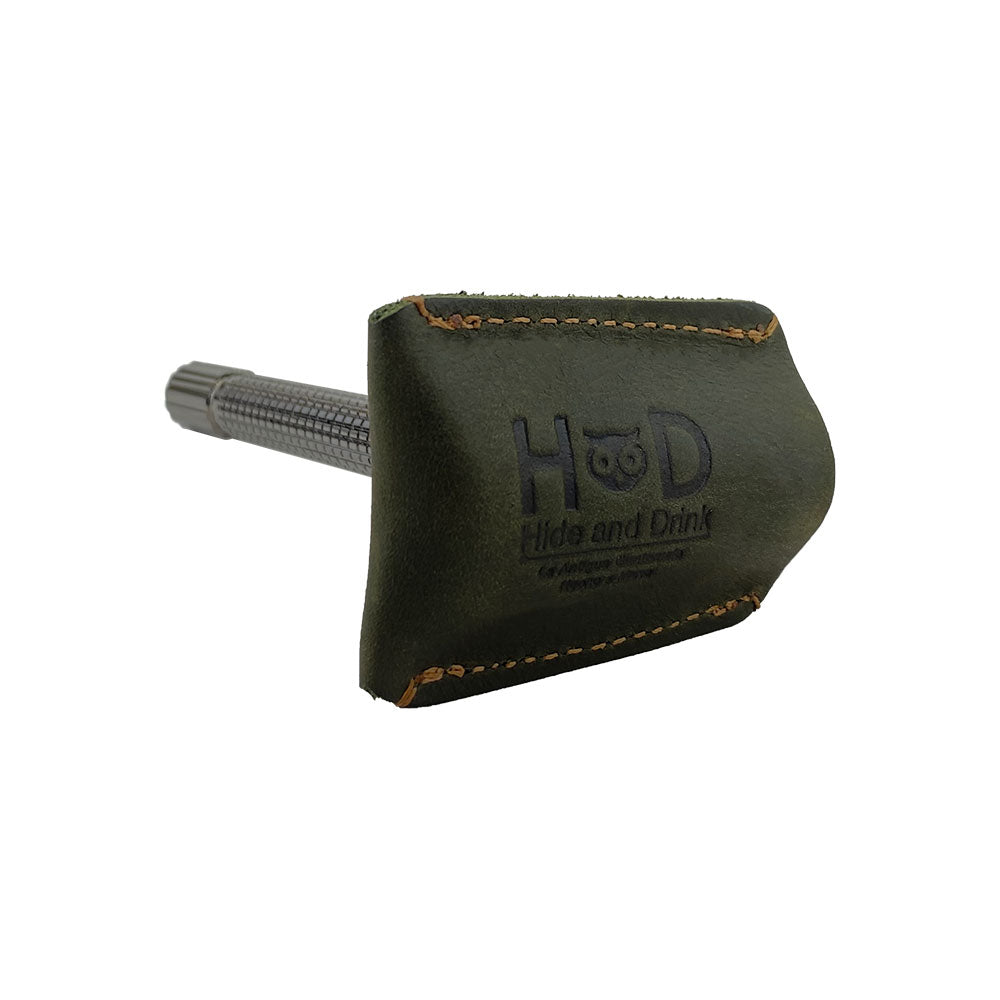 Razor Head Cover by Hide & Drink in action, showing the double edge safety razor fitted snugly into the full grain leather protective sheath, emphasizing its handcrafted quality perfect for shaving on the go.