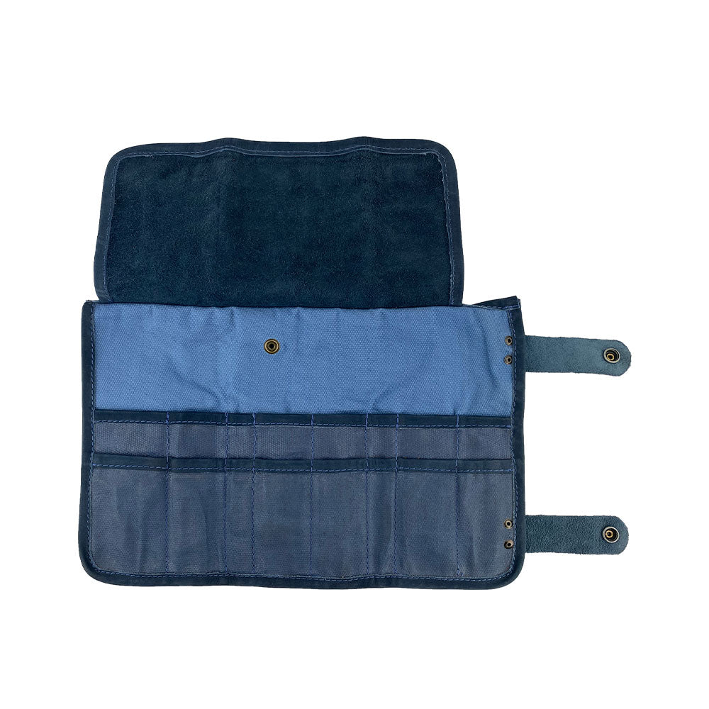 Hide & Drink's Barber Tool Roll, showcasing a Snap Tool Roll Up Bag with 14 Slots perfect for organizing scissors & screwdrivers. Constructed from high-quality Full Grain Leather, this portable carry case reflects StockyardX's commitment to small batch production and artisan craftsmanship, hand cut, hand sewn, and fire branded in La Antigua Guatemala & Oaxaca Mexico.