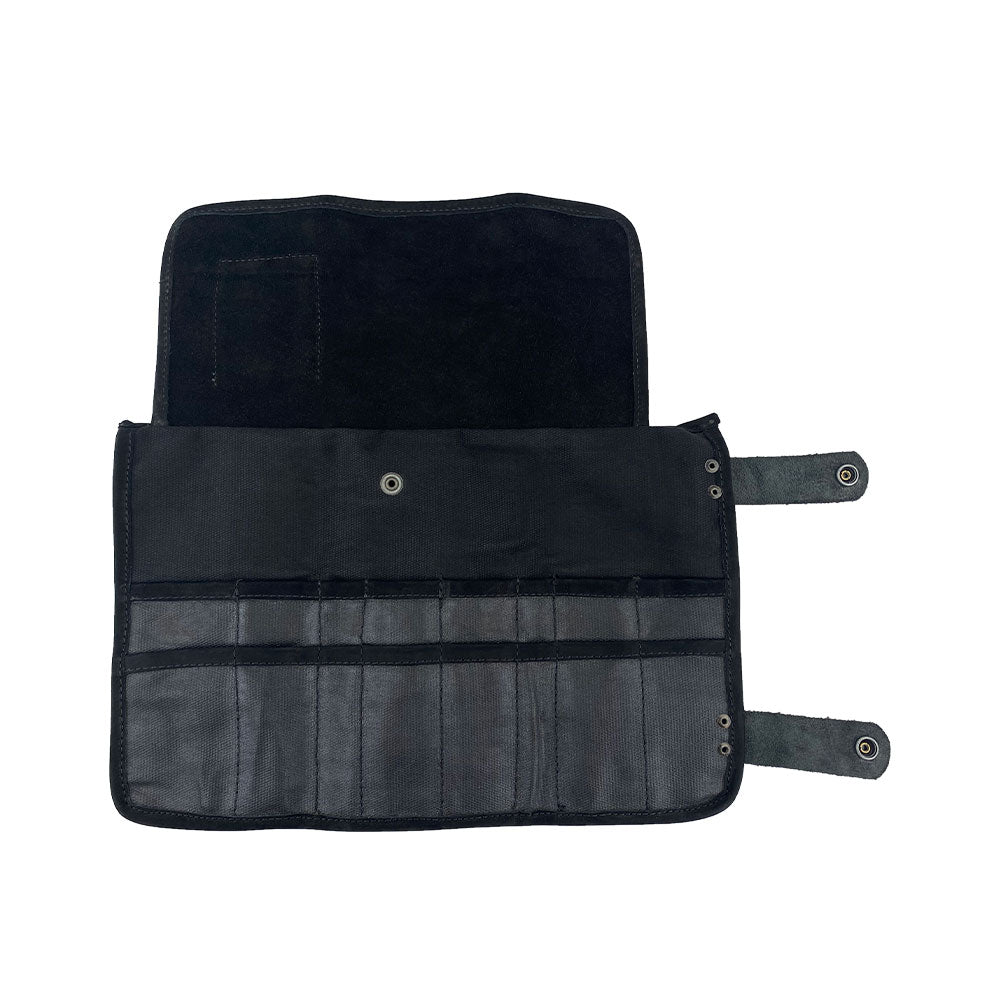 Hide & Drink's Barber Tool Roll showcases a Snap Tool Roll Up Bag with 14 Slots, ideal for scissors & screwdrivers. This durable portable carry case is made from Full Grain Leather and aligns with StockyardX's focus on small batch production and artisan craftsmanship, hand cut, hand sewn, and fire branded in La Antigua Guatemala & Oaxaca Mexico.