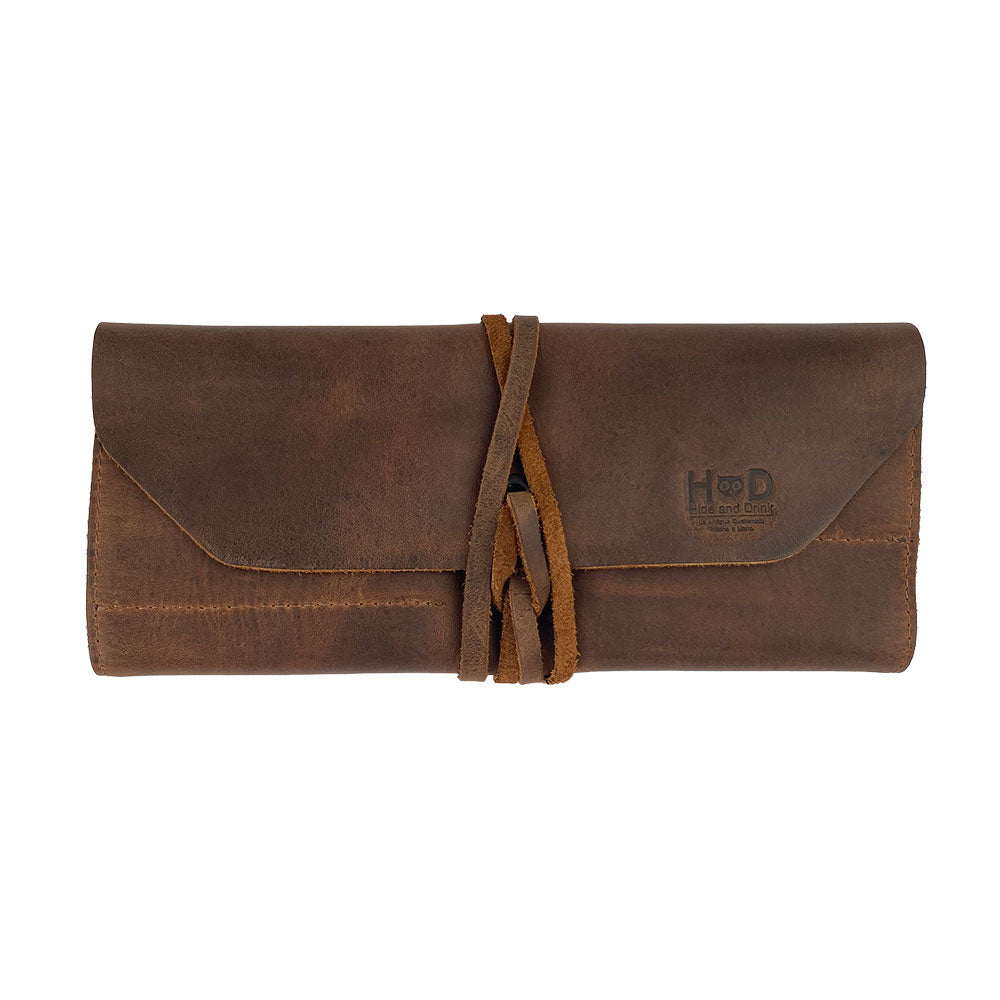 Hide & Drink Tool Roll offers a compact small tool roll-up bag with 10 slots, crafted from premium full grain leather. It's a great portable carry-on pouch for woodworking tools, making it a must-have for any workshop storage solution. This handmade artisan product reflects exquisite craftsmanship from La Antigua Guatemala & Oaxaca Mexico, combining vintage style and functionality.