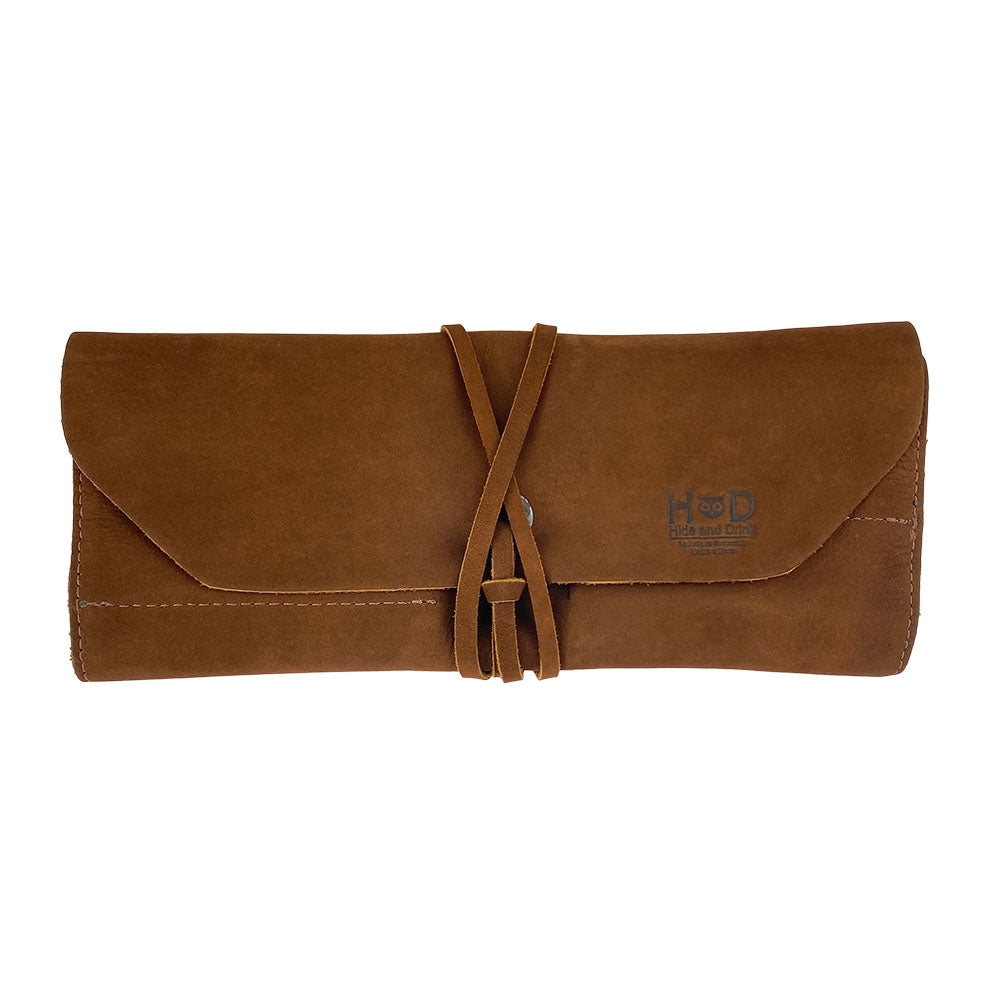 Hide & Drink Tool Roll presents a unique small tool roll-up bag with 10 slots, crafted from fine full grain leather. This portable carry-on pouch is essential for efficient woodworking tools organization, perfect for any workshop storage requirement. Each artisan item is hand cut and sewn, proudly produced in La Antigua Guatemala & Oaxaca Mexico.