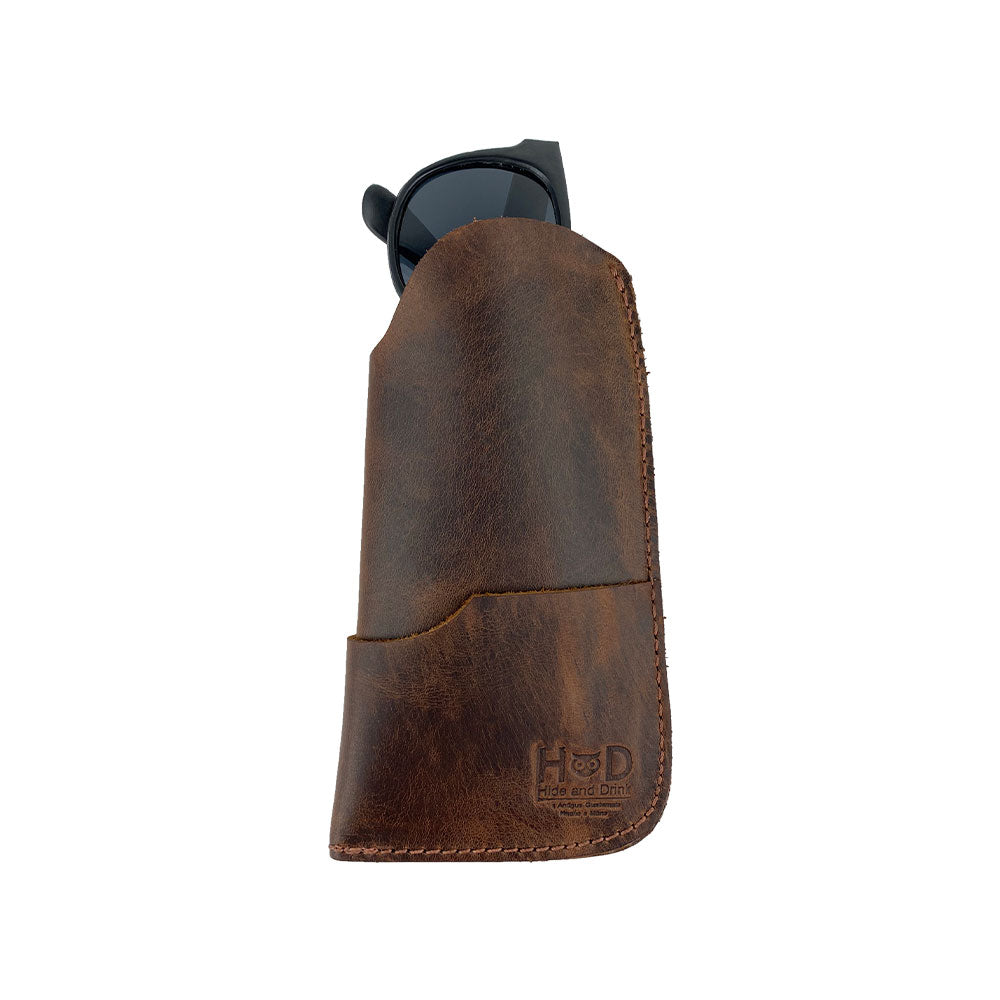 An impressive view of the Hide & Drink Sunglass Case & Wallet, a perfect blend of functionality and style. This Rustic Sunglasses Case & Wallet is handcrafted from Full Grain Leather, ideal as a glasses protector for travel, made in La Antigua Guatemala & Oaxaca Mexico.