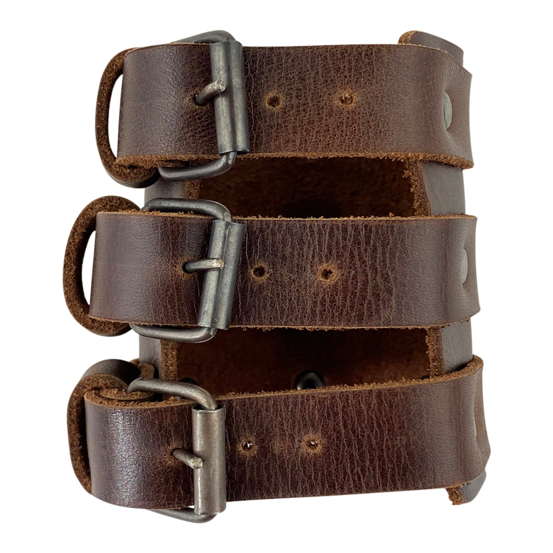 The 3 Buckle Bracelet from Hide & Drink viewed from the side, emphasizing its handcrafted quality and strong design. This men’s fashionable wristband is a trendy and durable accessory made from adjustable full grain leather in small batch production.