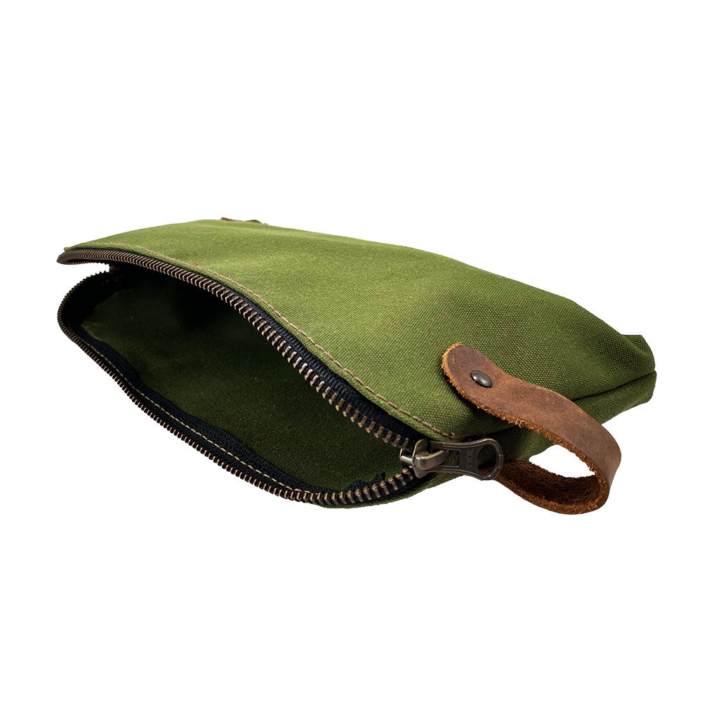 Dopp Kit Utility Bag by Hide & Drink illustrating its rugged design for modern use. This artisan Dopp Kit Utility Bag is ideal for storing essentials, crafted from full grain leather with emphasis on small batch production and quality craftsmanship hand cut and hand sewn, handmade in La Antigua Guatemala & Oaxaca Mexico.
