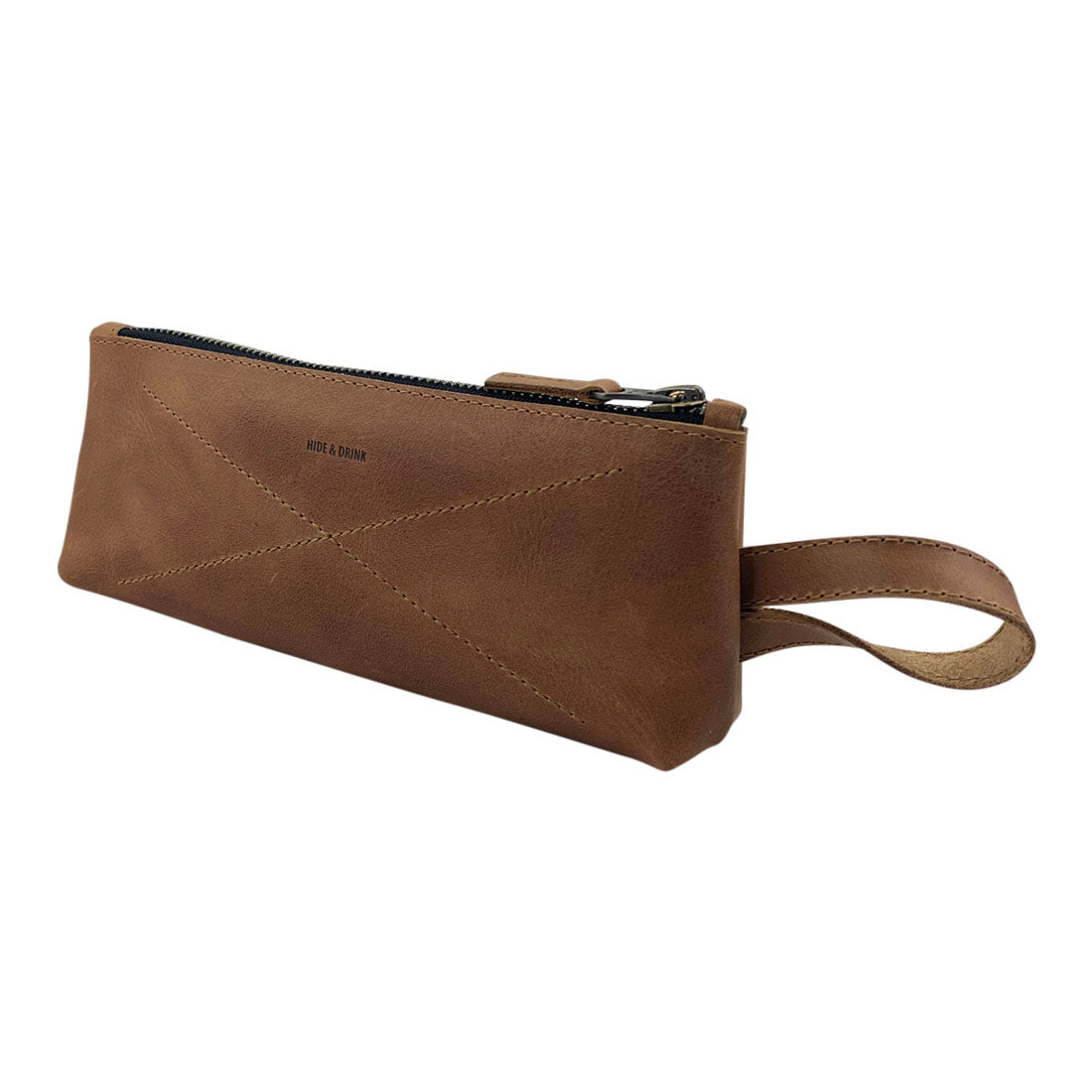 Hide & Drink's X Stitched Case, made with quality full grain leather, is ideal for storage of small items like utensils and cables. Artisan crafted in La Antigua Guatemala and Oaxaca, Mexico, it reflects a commitment to handmade excellence.