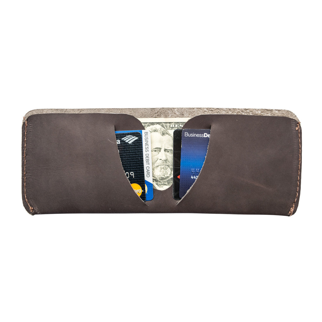Side view of the Hide & Drink Minimal Wallet to highlight its classic design, crafted from full grain leather overseeing a stylish finish. This Classic Slimfold Wallet acts as a practical Card Organizer Holder and Travel Accessory, painstakingly constructed through Small Batch Production by artisans in La Antigua Guatemala & Oaxaca Mexico.
