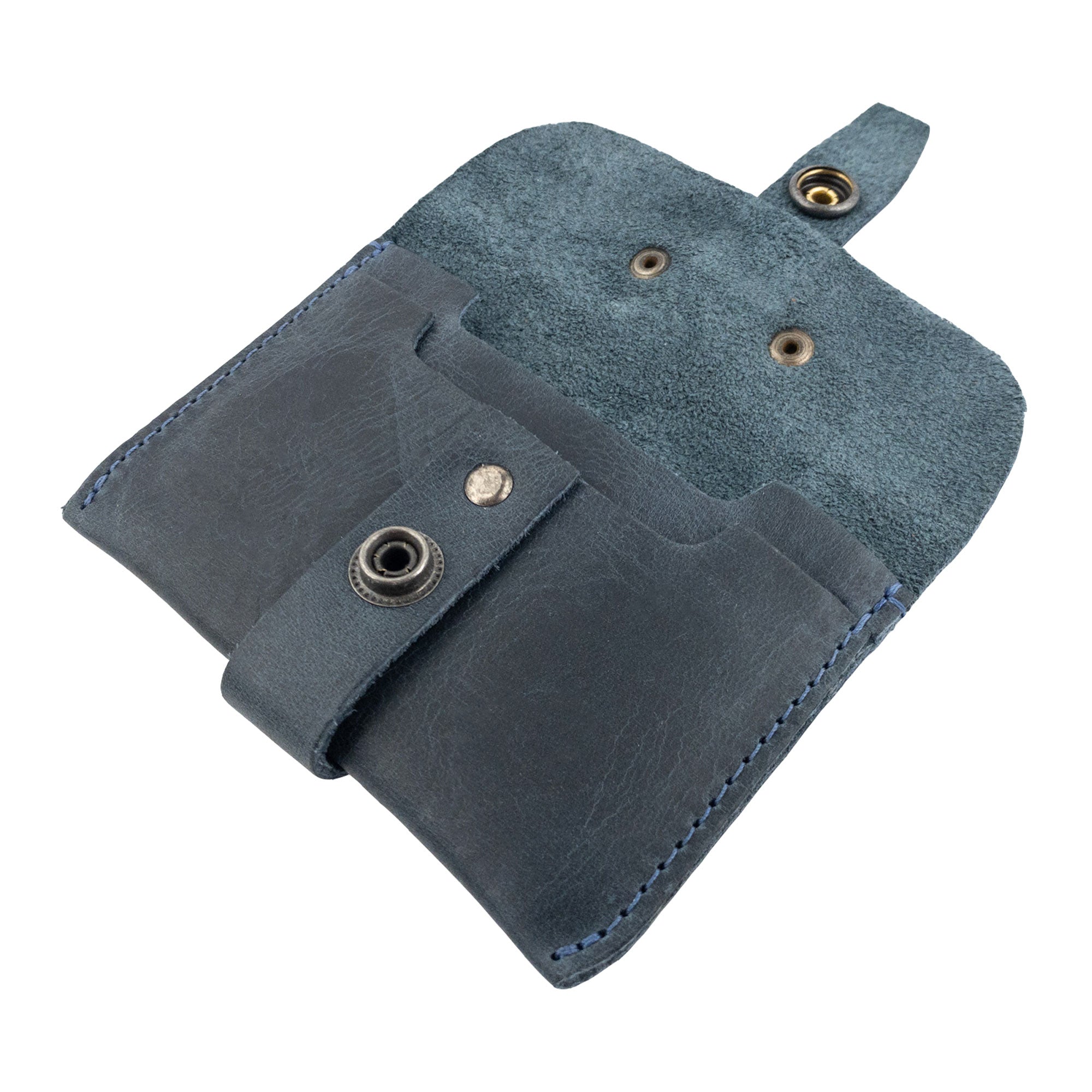 Back view of Hide & Drink's navy Credit Card Holder, showcasing its artisan branding. This Full Grain Leather wallet offers a unique touch to any minimalist front pocket setup, crafted with care in La Antigua Guatemala.