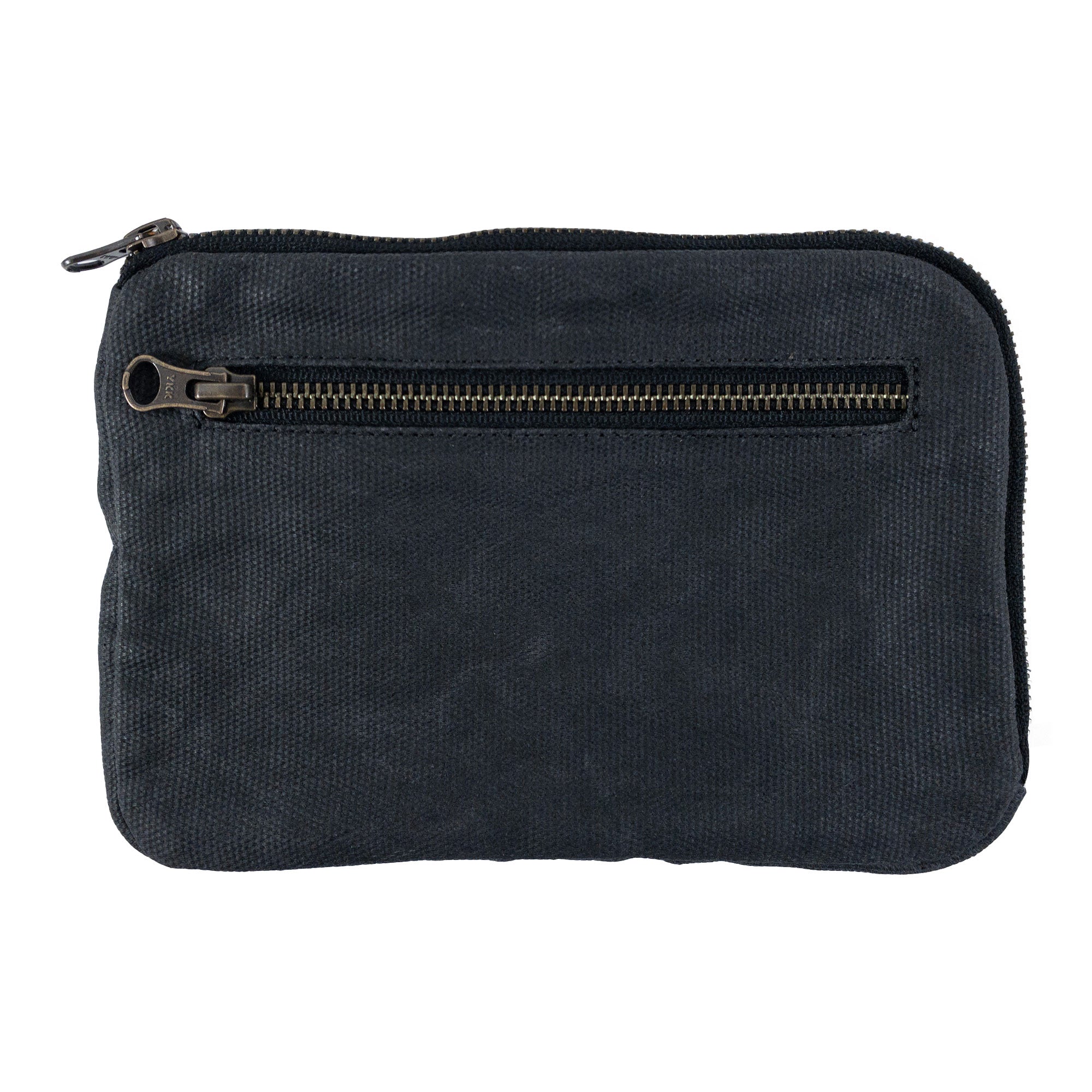 Exterior view of Hide & Drink's dark brown Zipper Gear Pouch demonstrating its sleek design and utility as a travel accessory, crafted from water resistant waxed canvas.