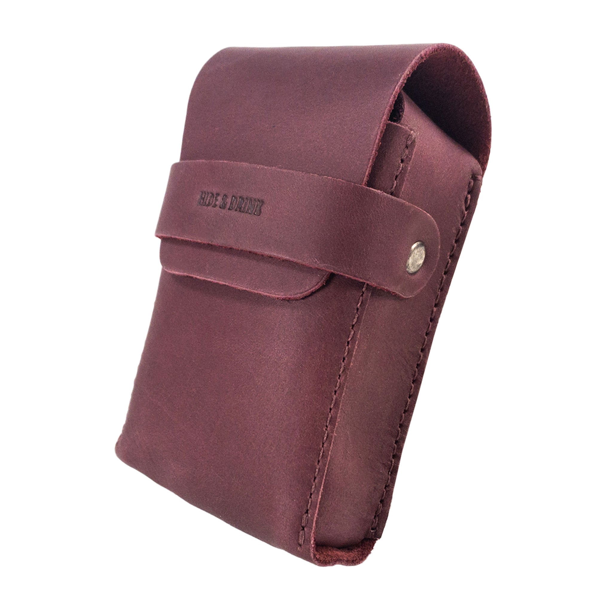 Side view of Hide & Drink's burgundy Playing Card Case, showcasing fine stitching. This classic case for playing cards (not included) offers secure storage in durable full grain leather, reflecting StockyardX's commitment to artisanal quality.