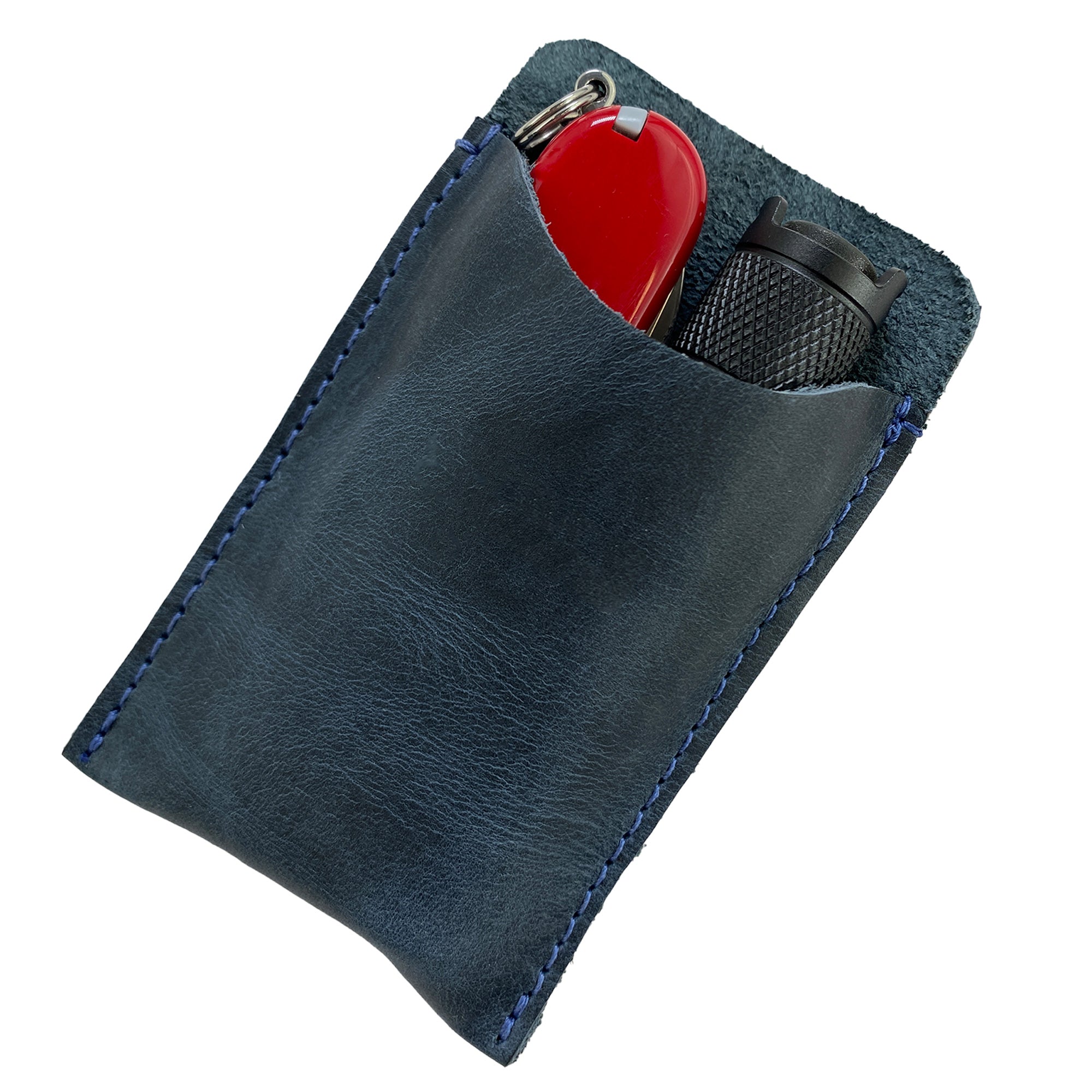 A close-up of Hide & Drink's Multitool Pocket Sleeve EDC showcasing its premium leather finish, ideal for everyday carry. This small tool organizer is hand sewn, representing artisan practices in La Antigua Guatemala, making it a perfect camping accessory.