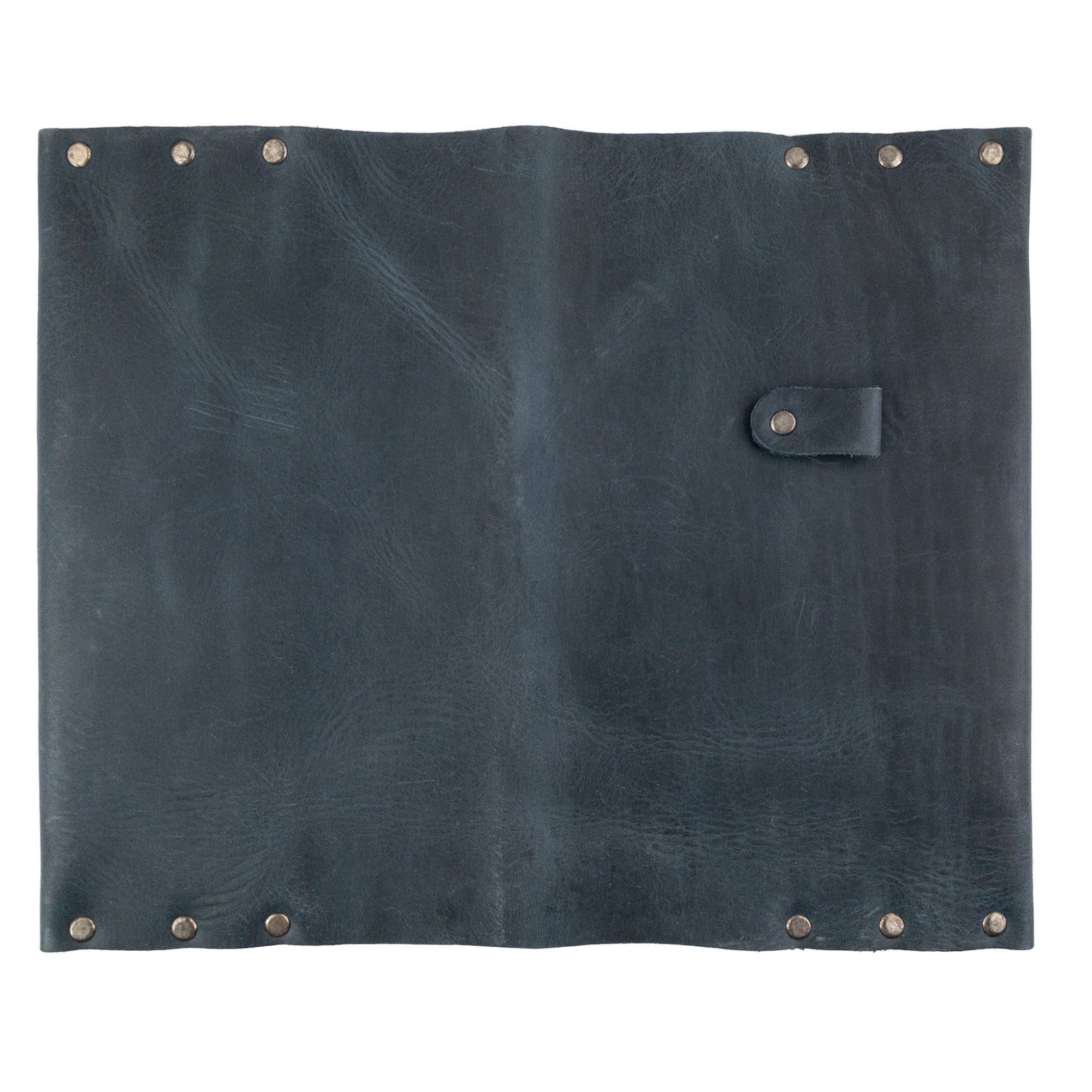 Back view of the Riveted Journal Cover (5 x 8.50 in.) from Hide & Drink, highlighting its elegant design made of full grain leather. Ideal for notebooks not included, this classic sleeve reflects the artistic skills from small batch production, handmade in La Antigua Guatemala & Oaxaca Mexico.