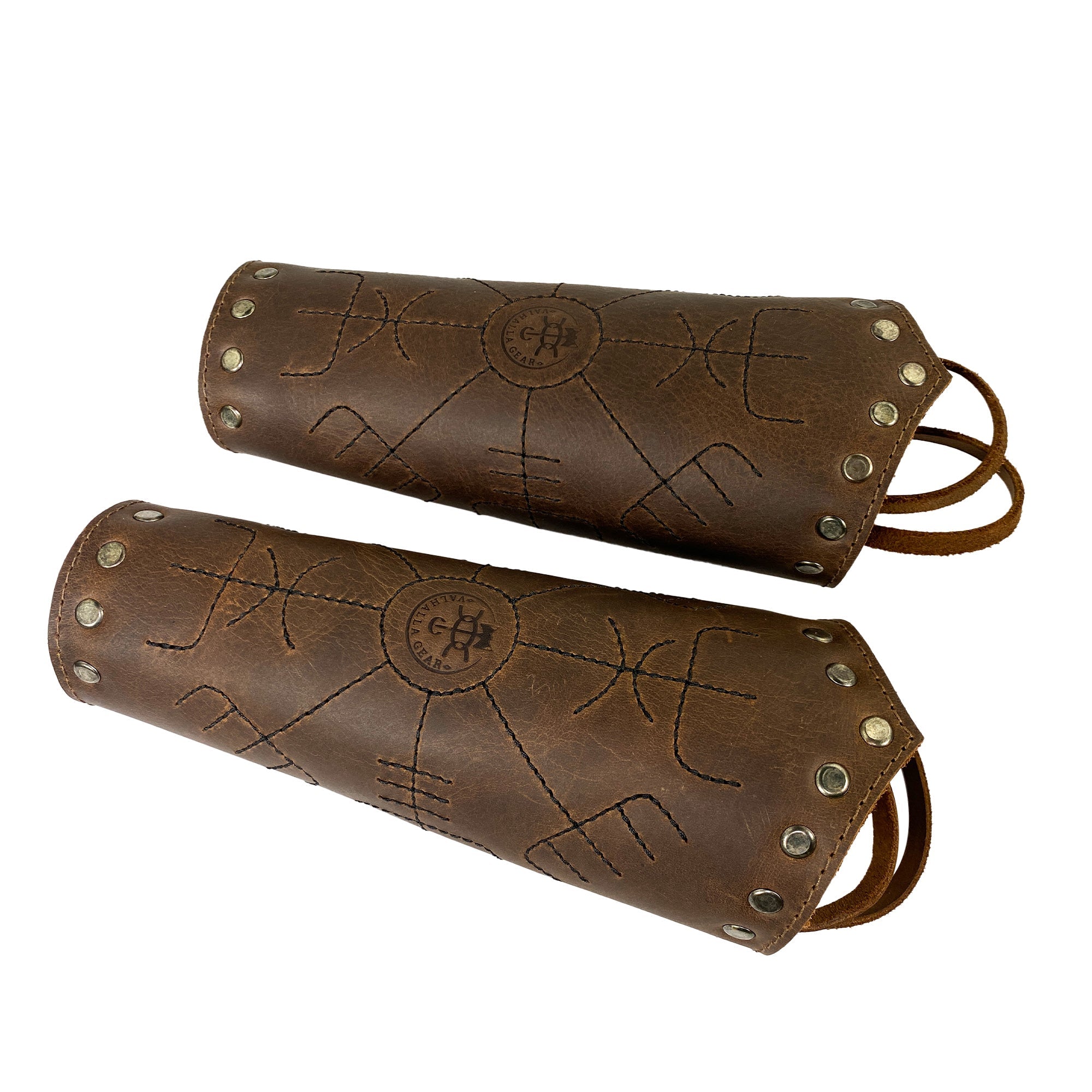 Pair of Viking Bracers from Valhalla Gear, beautifully designed with Viking symbols. This Viking Bracer (2 pack) serves as a reliable wrist guard for archers and medieval warriors alike. Crafted from full grain leather with adjustable straps, each piece is hand cut and sewn, highlighting the artisan quality of products made in La Antigua Guatemala.