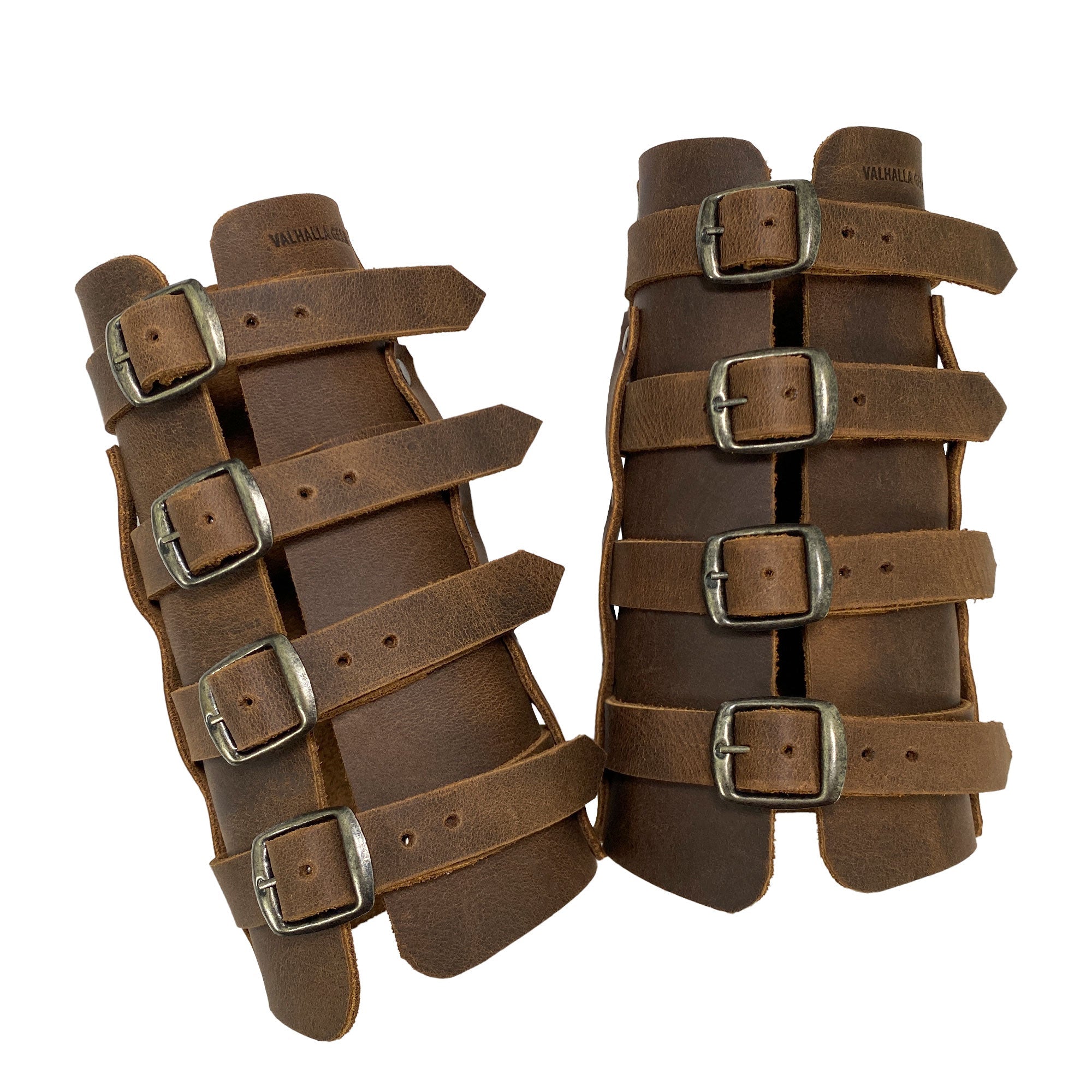 The 4 Buckle Bracelet (2 Pack) by Valhalla Gear is seen in this image, showcasing its sturdy design perfect for medieval archery. Handcrafted with full grain leather, these wrist guards offer adjustable fit and are a testament to the artisan production by StockyardX from La Antigua Guatemala & Oaxaca Mexico.