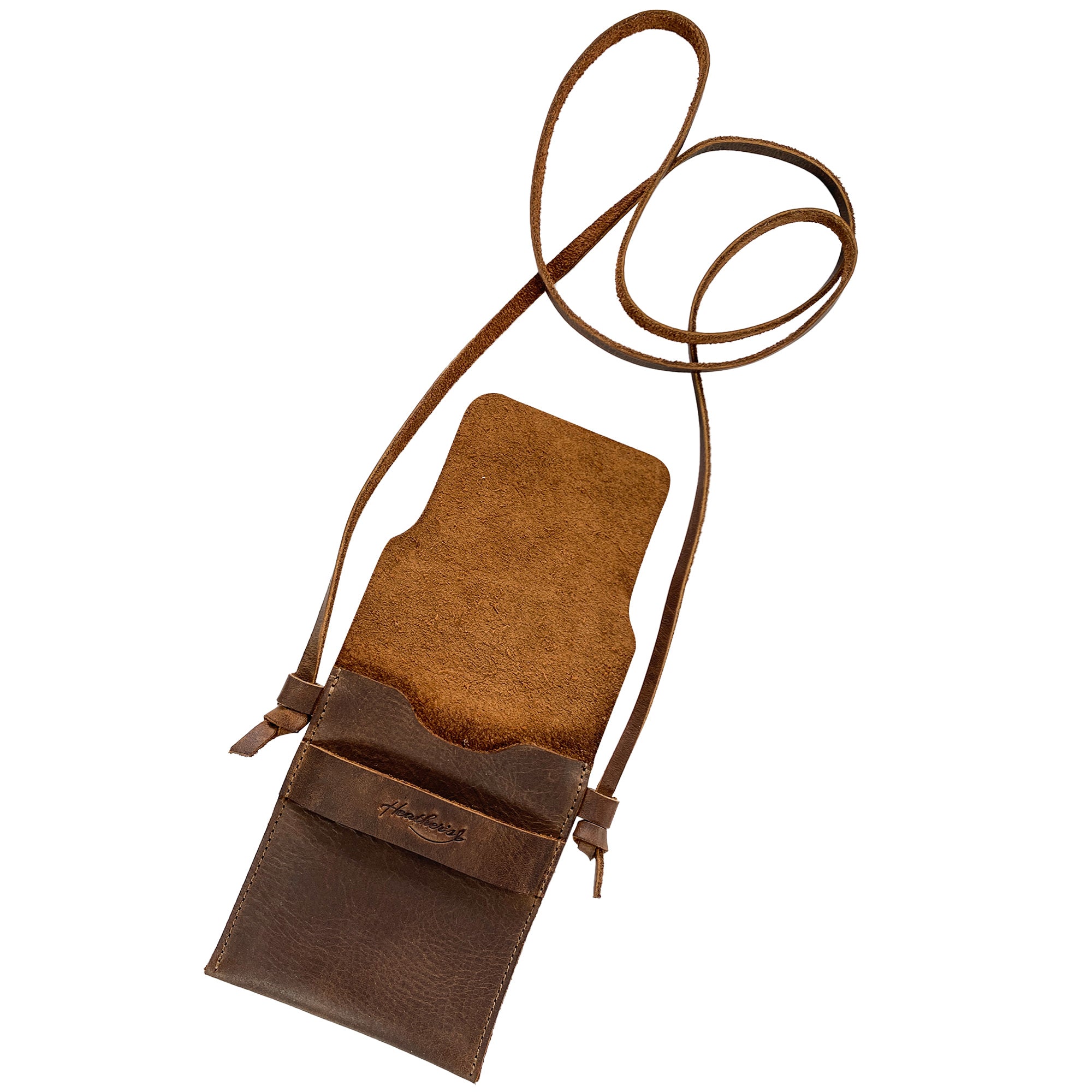 Open view of the Mini Travel Bag by Heather's displaying its spacious interior. This Mini Travel Bag Handmade from Full Grain Leather is a classic organizer, coin pouch, and storage case for ID, credit cards, and cash. StockyardX, Small Batch Production, Hand Cut, Hand Sewn, Fire Branded, Artisan, Handmade in La Antigua Guatemala & Oaxaca Mexico.