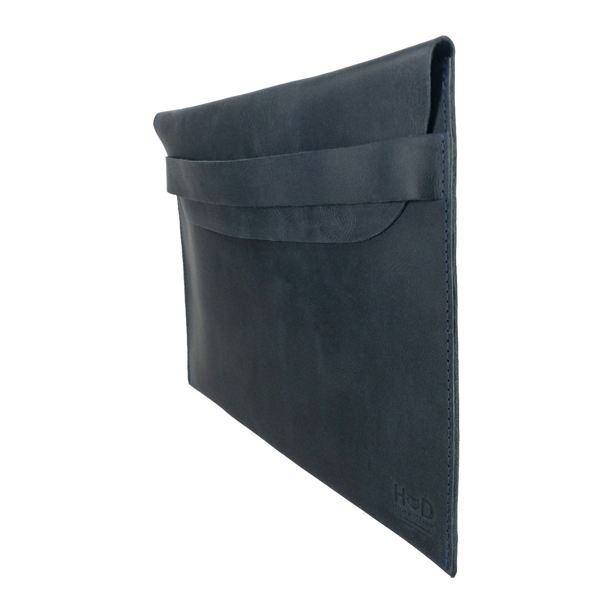 Side profile of the black Hide & Drink MacBook Slim Case demonstrating its stylish design. Perfect for MacBook Air/Pro 13 Inch with M1 Chip, showcasing unique artisan quality and durable full grain leather for everyday protection.