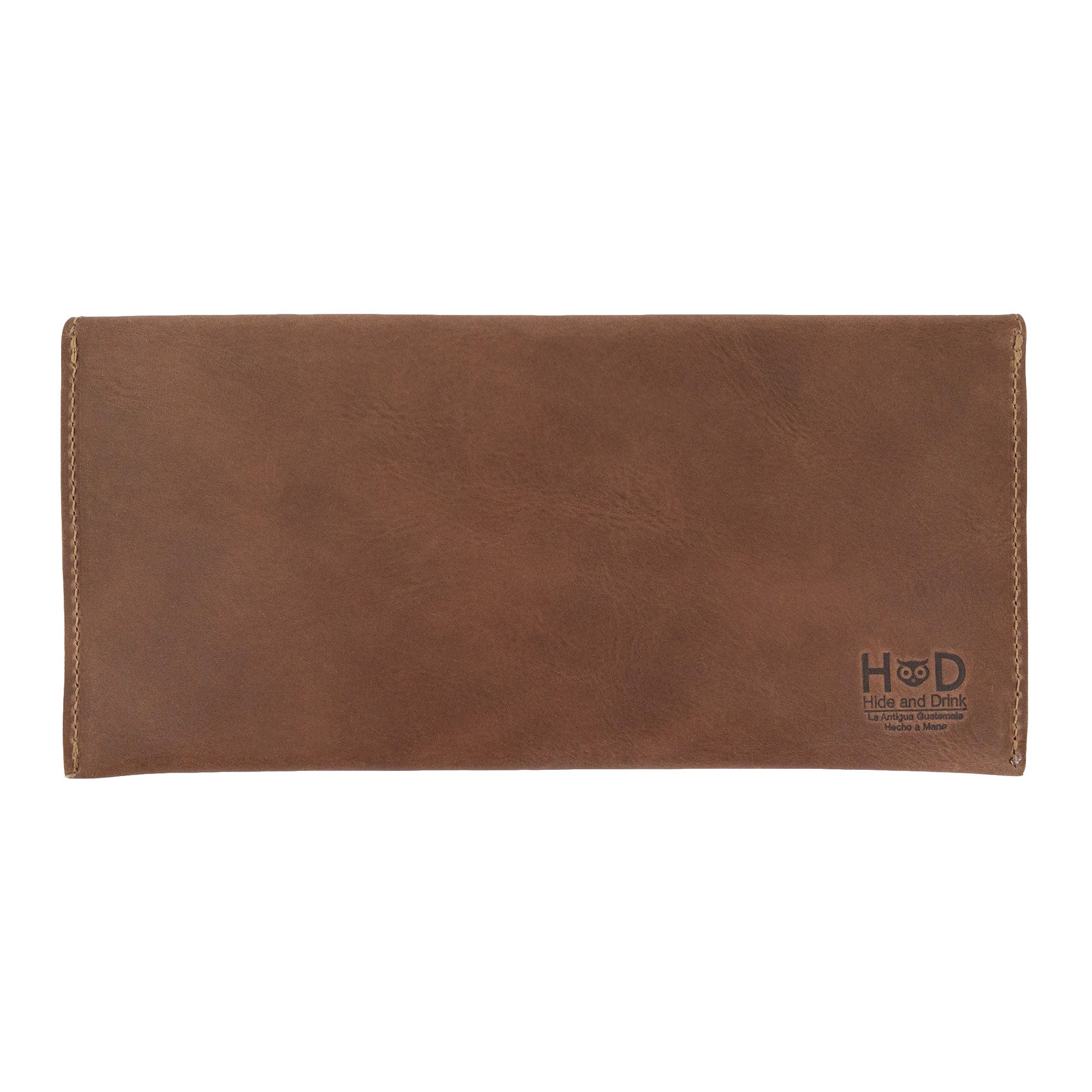 The back of Hide & Drink's brown Travel Hand Wallet, showcasing the quality of Full Grain Leather and craftsmanship. This Travel Wallet represents Small Batch Production and is handmade in La Antigua Guatemala & Oaxaca Mexico.