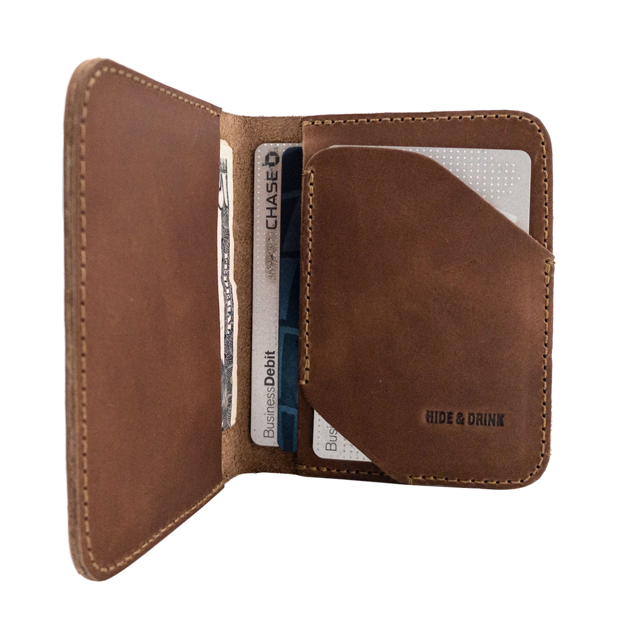 Bi-Fold Card Wallet Diagonal by Hide & Drink demonstrating a stylish way to store cards and cash, showcasing artisan craftsmanship with full grain leather.