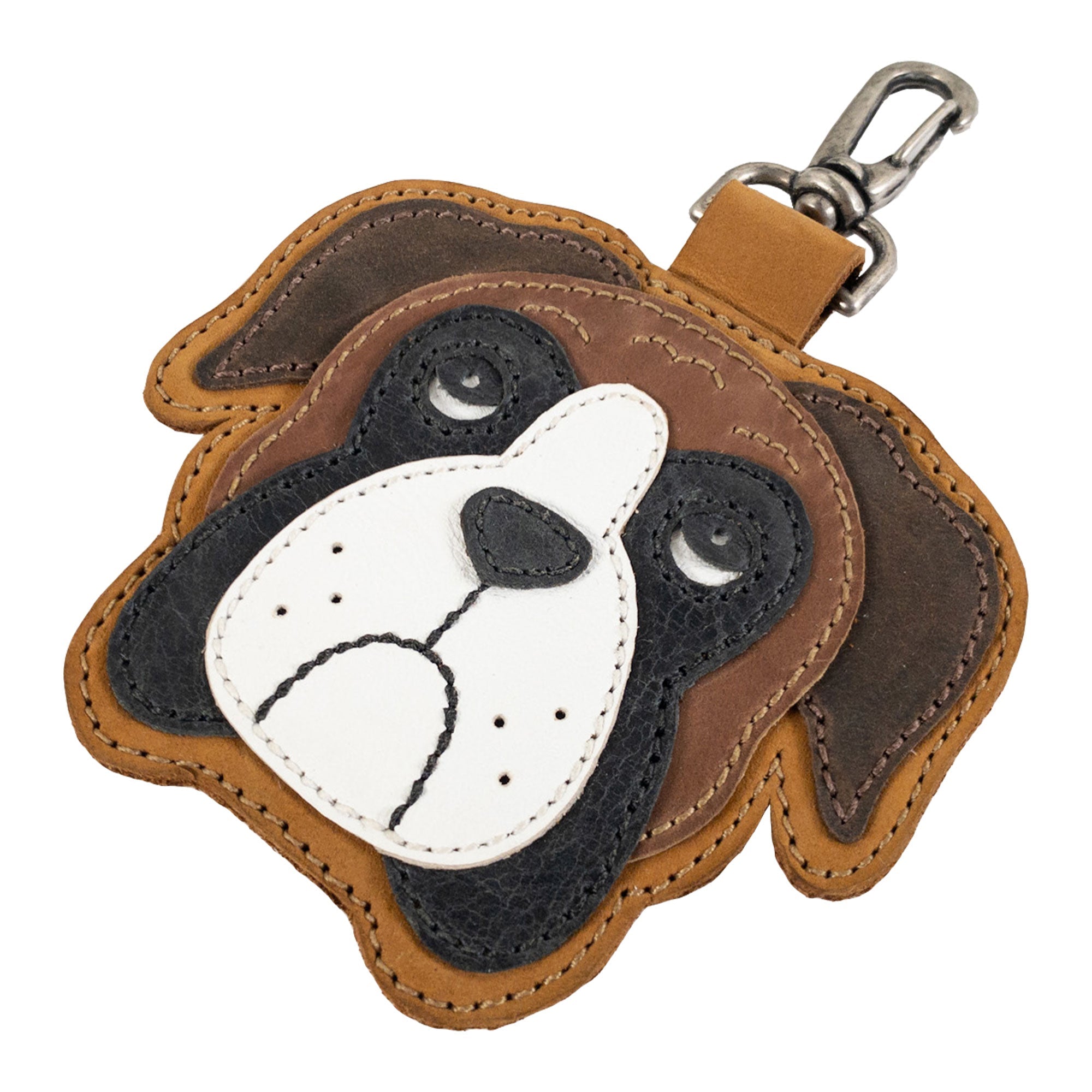 Close-up of the Boxer Face Charm by TACO DOG, highlighting intricate stitching and design in Full Grain Leather. This handmade charm exemplifies small batch production, featuring artisan craftsmanship with hand cut and hand sewn methods. Designed and made in La Antigua Guatemala & Oaxaca Mexico.