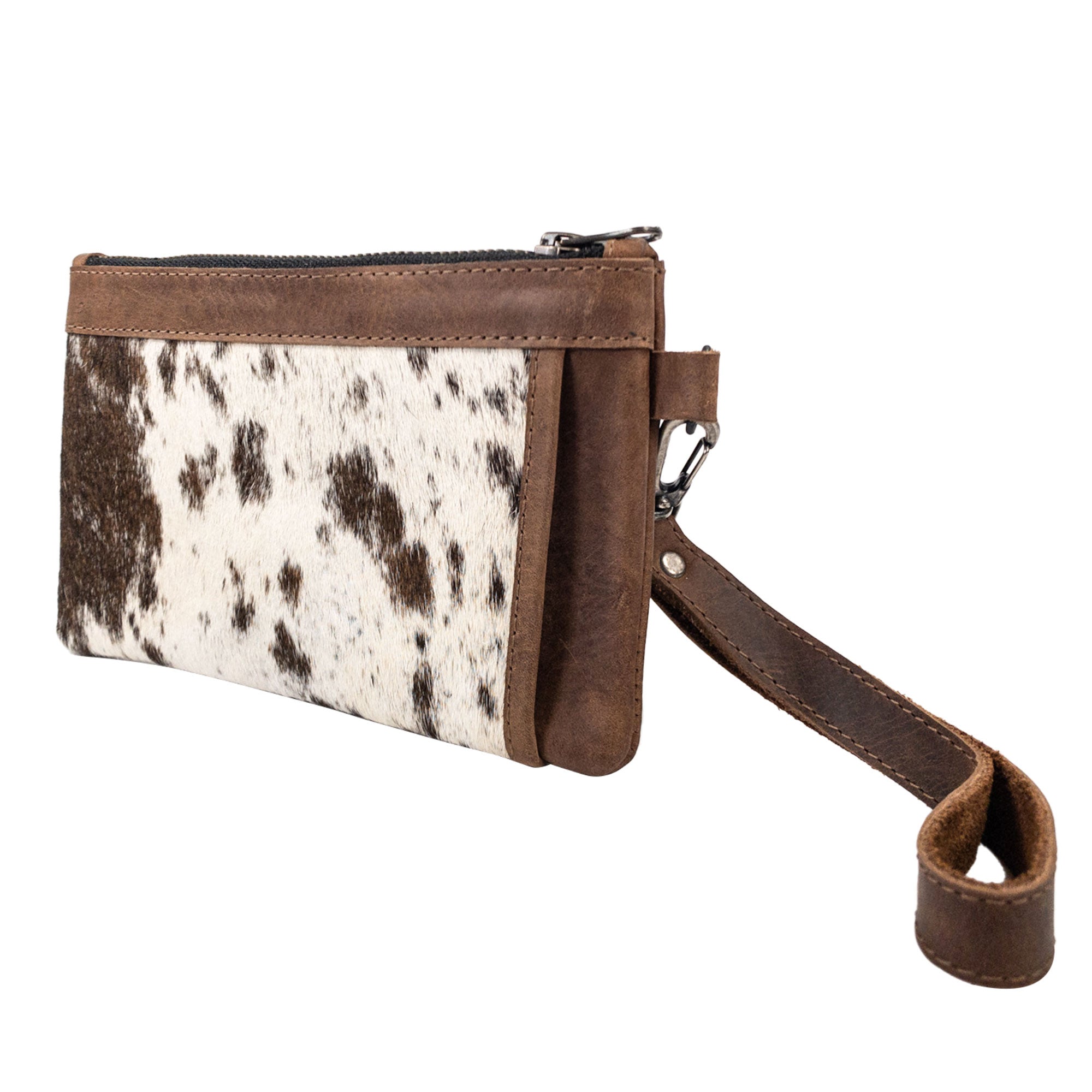 Stylish side view of the handmade Wristlet Clutch Bag by Western Leather Works, featuring a unique hair-on-hide leather design. This rectangular wristlet clutch handbag combines Western style with the strength of full grain leather, crafted through small batch production and artisan techniques in La Antigua Guatemala.