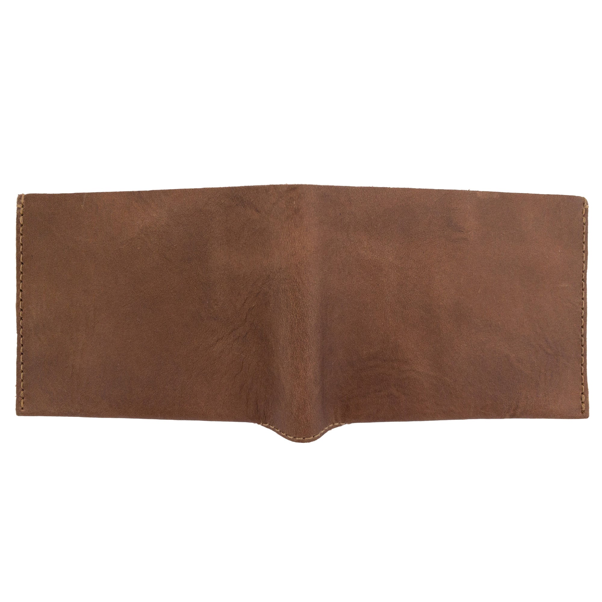 Angled view of the brown Hide & Drink Classic Wallet demonstrating its compact and stylish design ideal for personal use. Classic Wallet, Card Organizer, Money Holder, Vintage Pocket, Travel Accessories, Full Grain Leather, StockyardX, Small Batch Production, Hand Cut, Hand Sewn, Fire Branded, Artisan, Handmade in La Antigua Guatemala & Oaxaca Mexico.