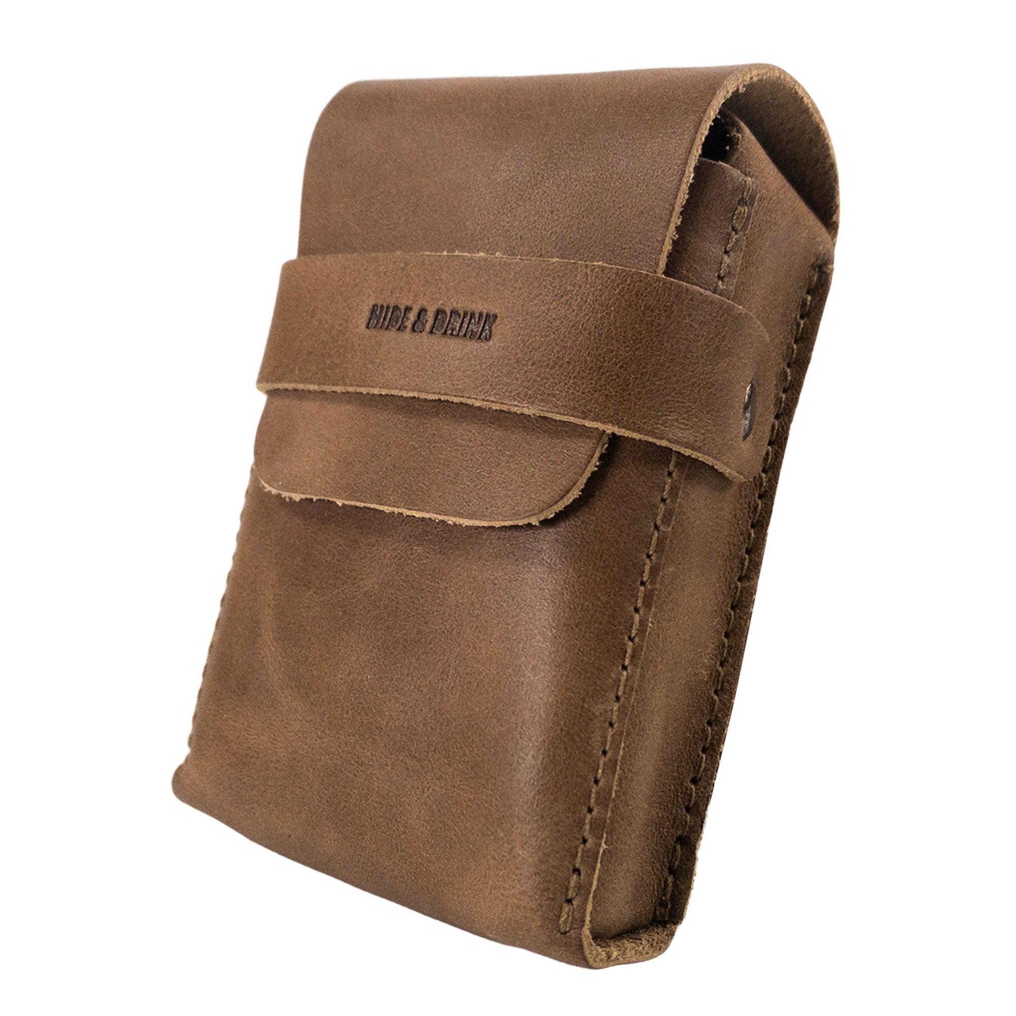 Side view of Hide & Drink's brown Playing Card Case, highlighting its sleek design. This stylish accessory serves as a classic case for playing cards (not included), made from quality full grain leather. Artisan crafted by StockyardX, it promises durability and elegance.