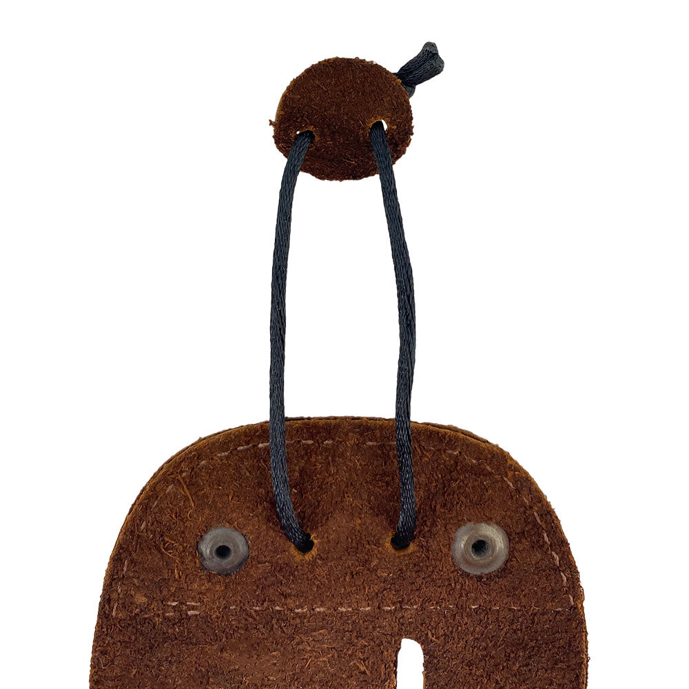 Right Handed Archery Finger Protector by Hide & Drink, showcasing its detail in premium full grain leather. This archery finger tab is a protective guard for recurve bows, ideal for enhancing your shooting practice gear sports & outdoors. Artisan-made with fire branded detail, it's hand cut and hand sewn, reflecting the quality of small batch production in La Antigua Guatemala.