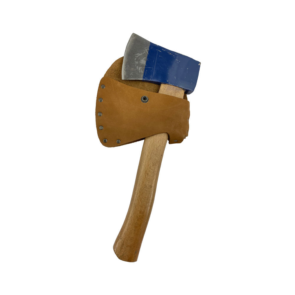 Hide & Drink Hatchet Head Sheath shown with an axe, emphasizing its role as a solid holster for 1.5 in. belts. This durable blade cover is also an axe head case suitable for lumberjack outdoors work, showcasing artisanal craftsmanship.